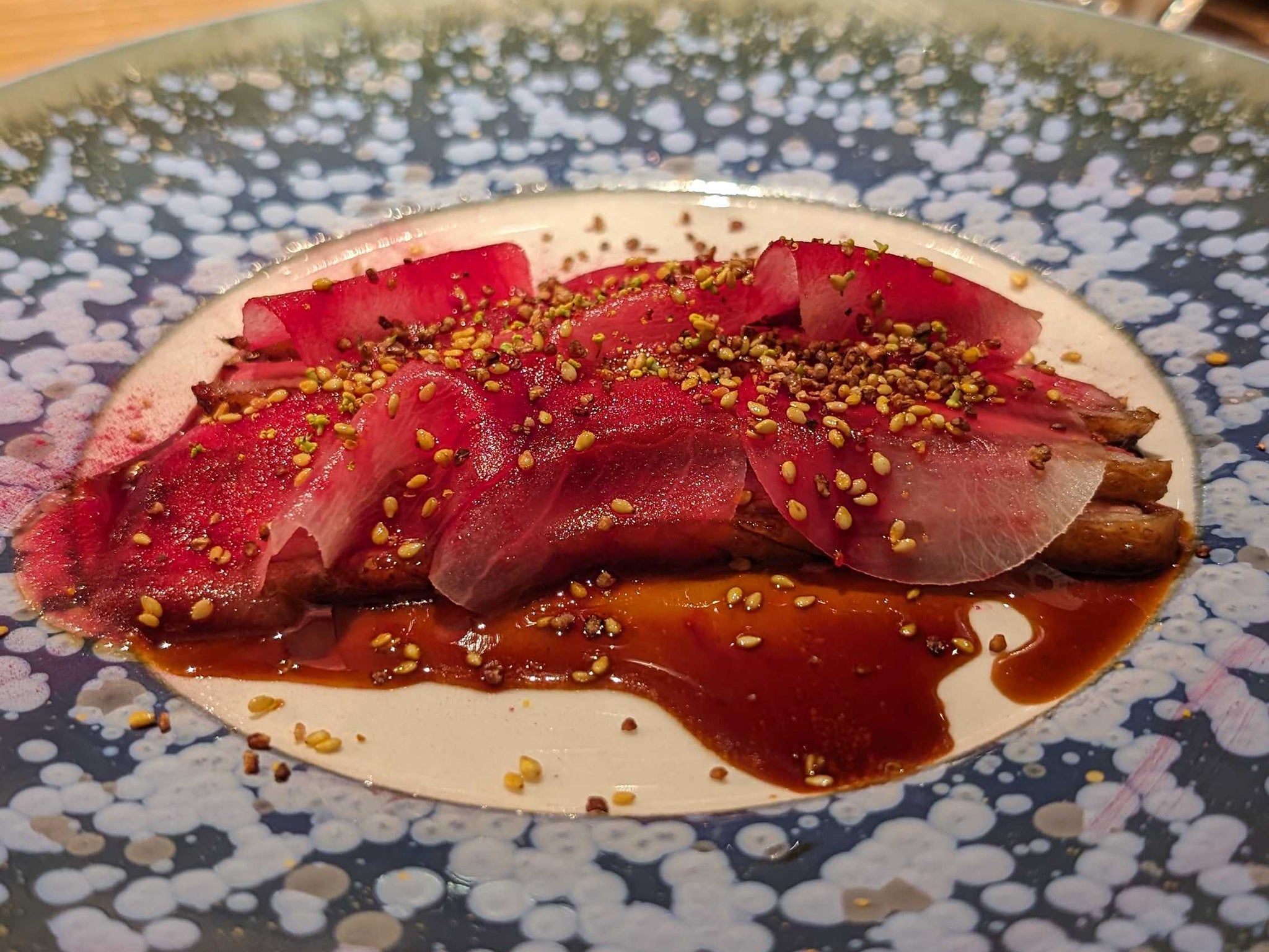 Roasted duck magret with marinated daikon radishes is a dish that cannot be missed