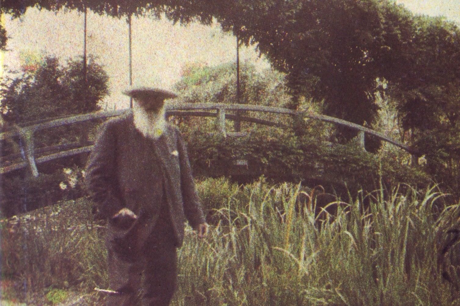 A photo of pioneering Impressionist Claude Monet in his famous gardens in Giverny, France, circa 1917