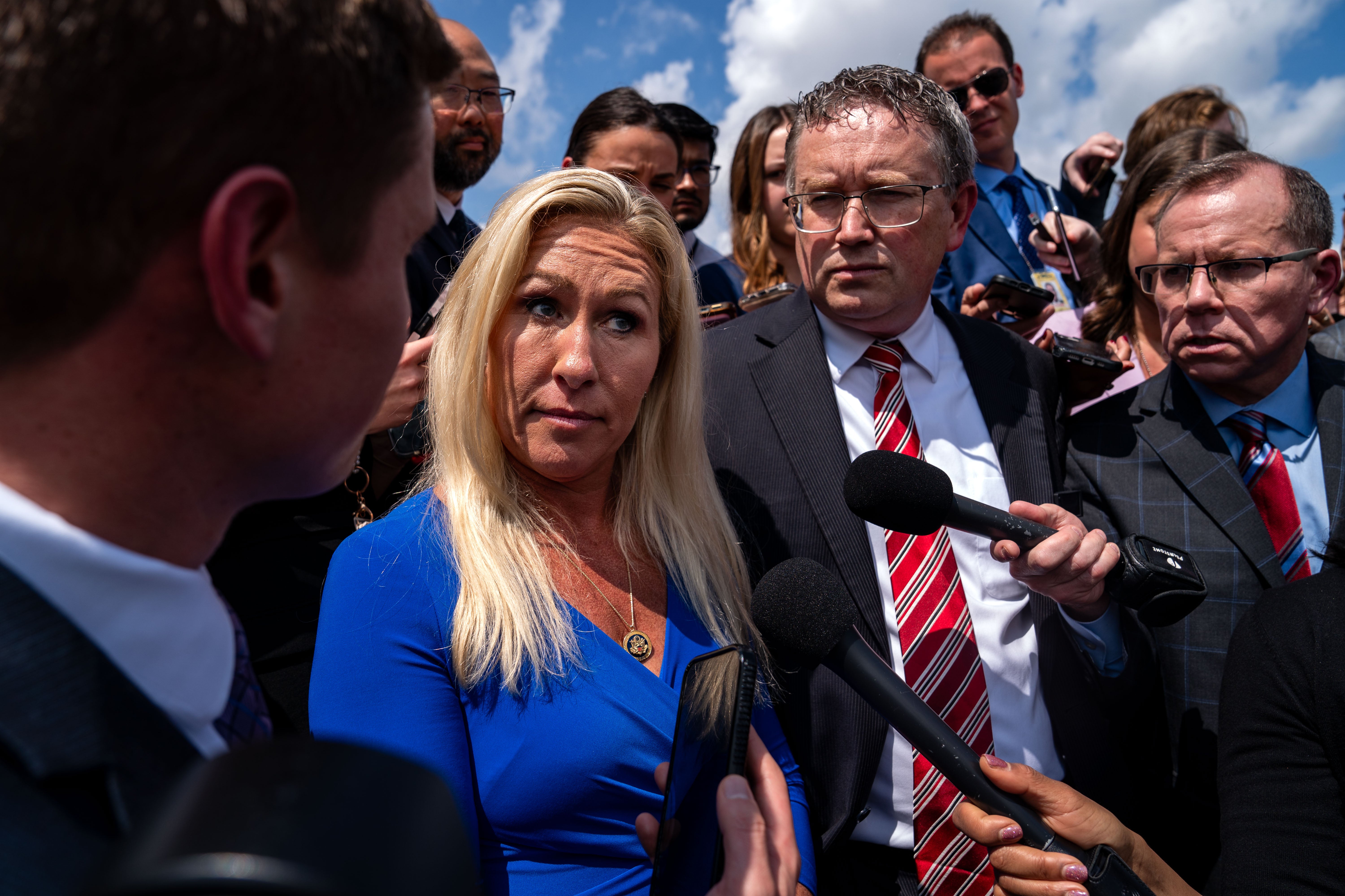 Marjorie Taylor Greene and Thomas Massie speak to members of the press on the steps of the House of Representatives