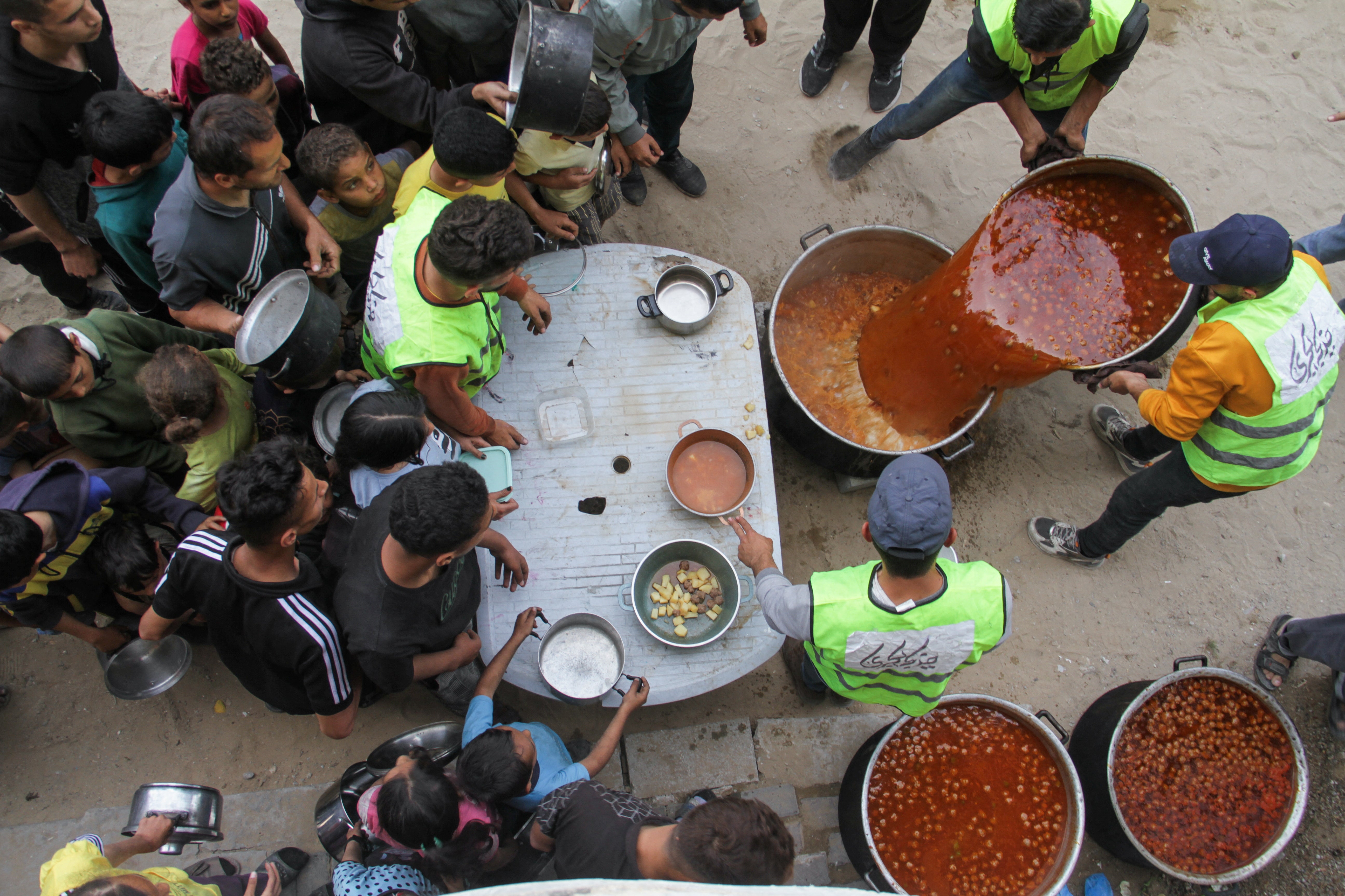 Volunteers deliver food to families in Gaza in April 2024. At least 35,000 people have been killed in Gaza since 7 October 2023