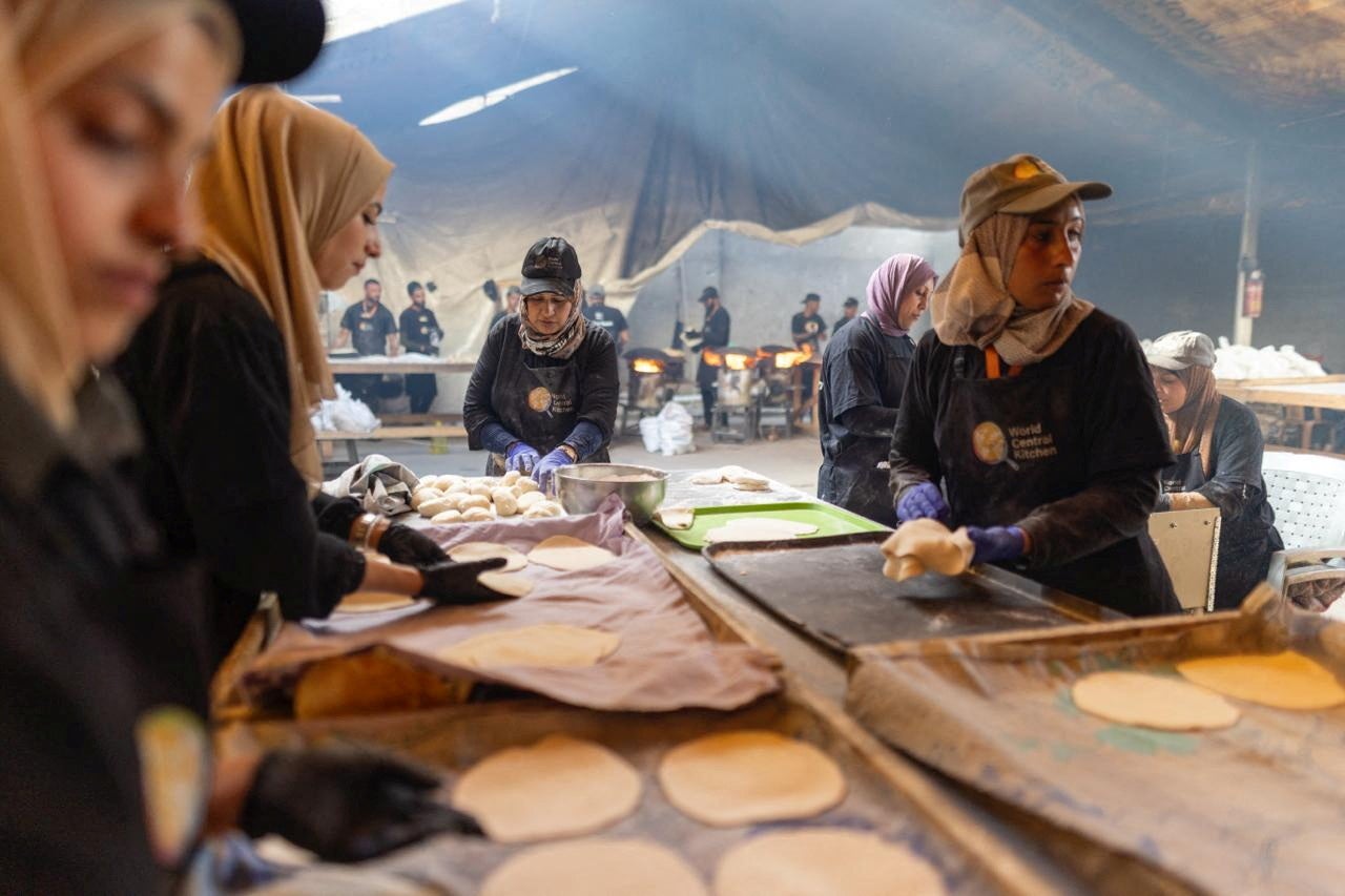 World Central Kitchen team prepare food for displaced Palestinians after resuming work in Gaza in this handout picture released on 30 April
