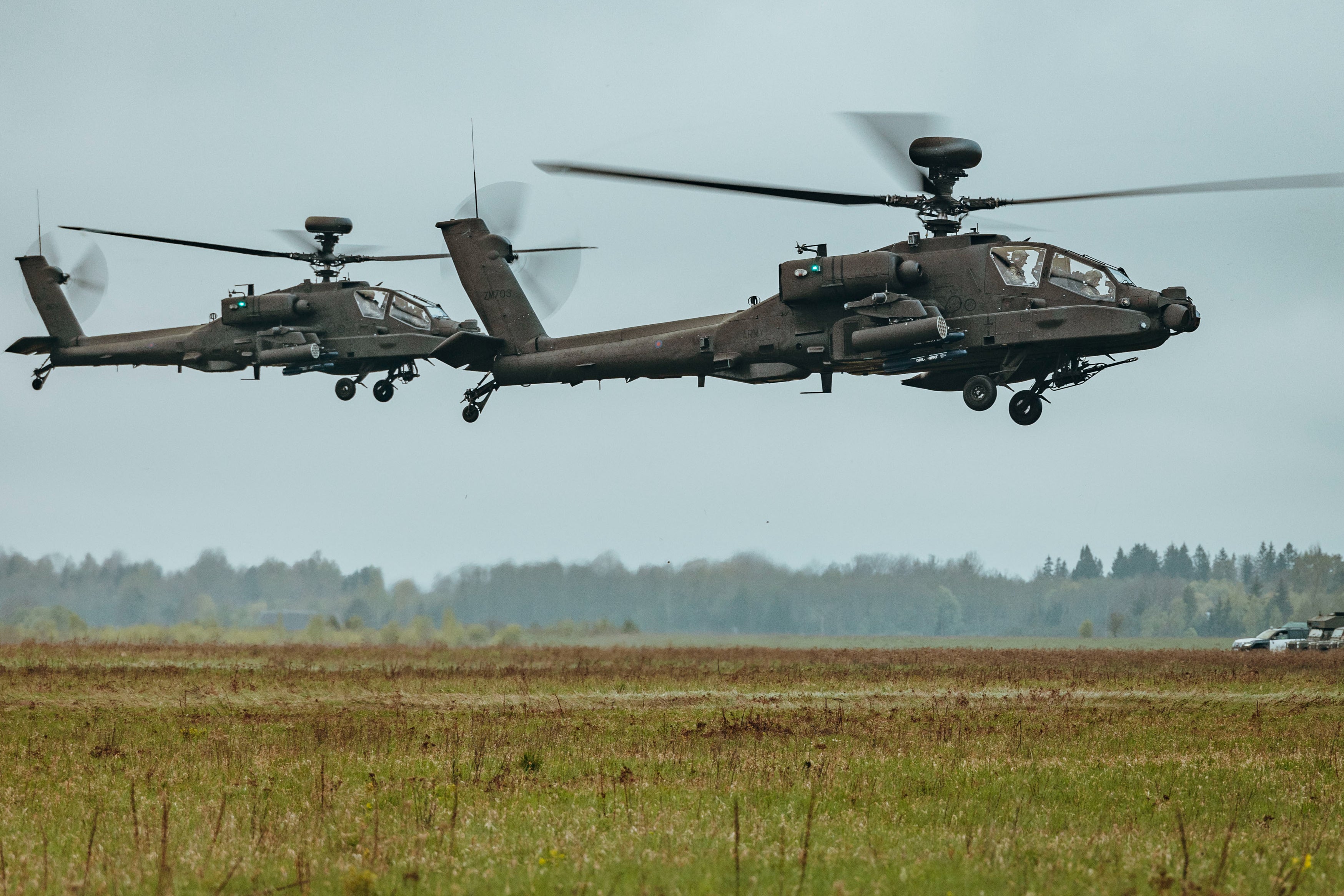 Apache helicopters from the 3 Regiment Army Air Corps support ground troops of the 3rd Battalion, the Parachute Regiment