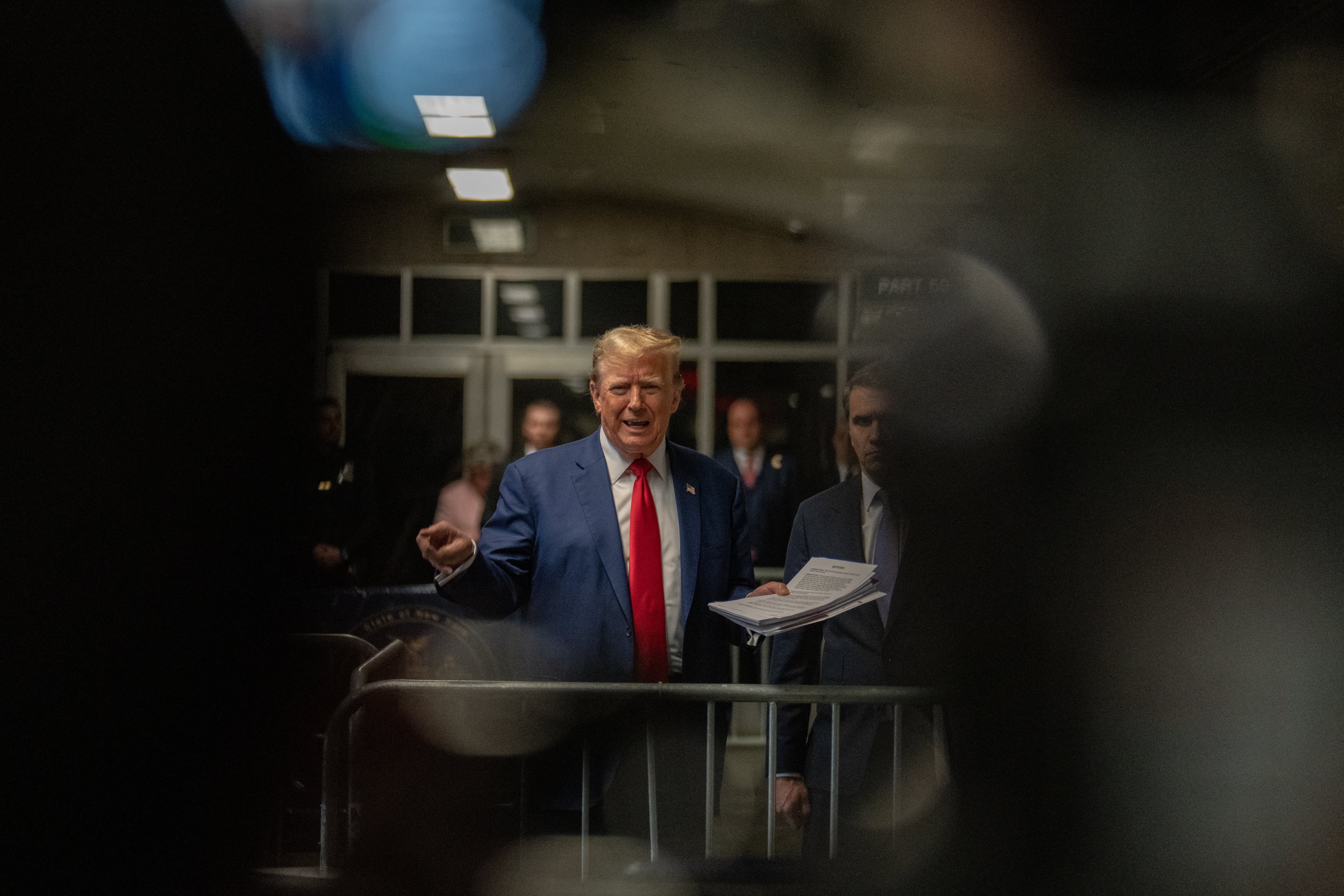 Donald Trump speaks to reporters inside the criminal courthouse in Manhattan on 10 May