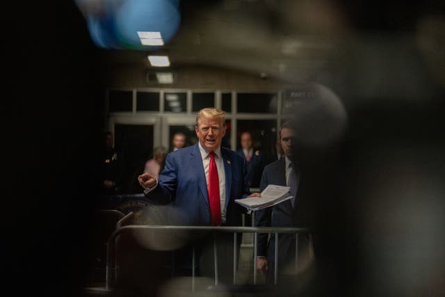 <p>Donald Trump speaks to reporters inside a criminal courthouse in Manhattan on 10 May</p>