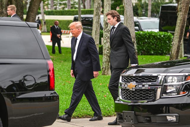 <p>Donald Trump and Barron Trump attend a funeral for Melania Trump’s mother in January. Mr Trump recently told a local news outlet his 18-year-old son gives him political advice</p>