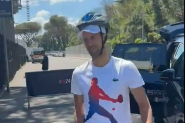 <p>Novak Djokovic donned a bike helmet at the Italian Open </p>