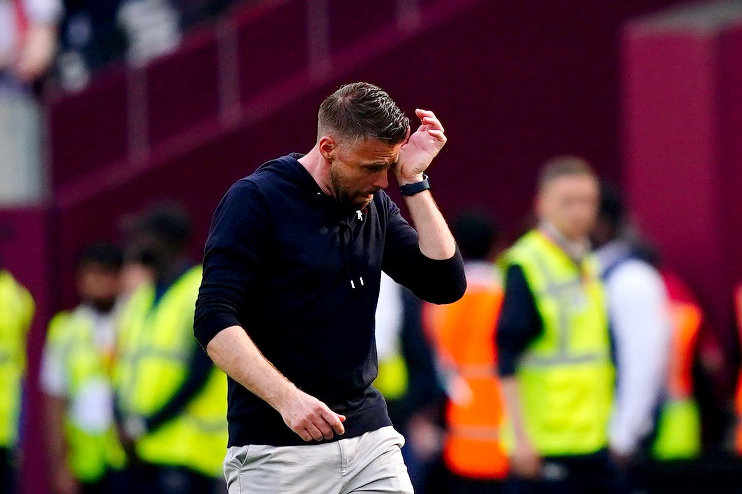 Luton manager Rob Edwards wipes away tears at the final whistle (Victoria Jones/PA).