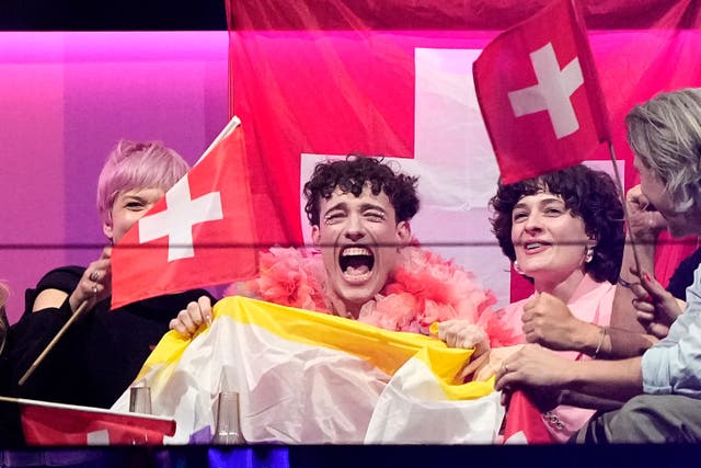 <p>Nemo of Switzerland who performed the song The Code celebrates as the judges votes start to be announced (Martin Meissner/AP)</p>