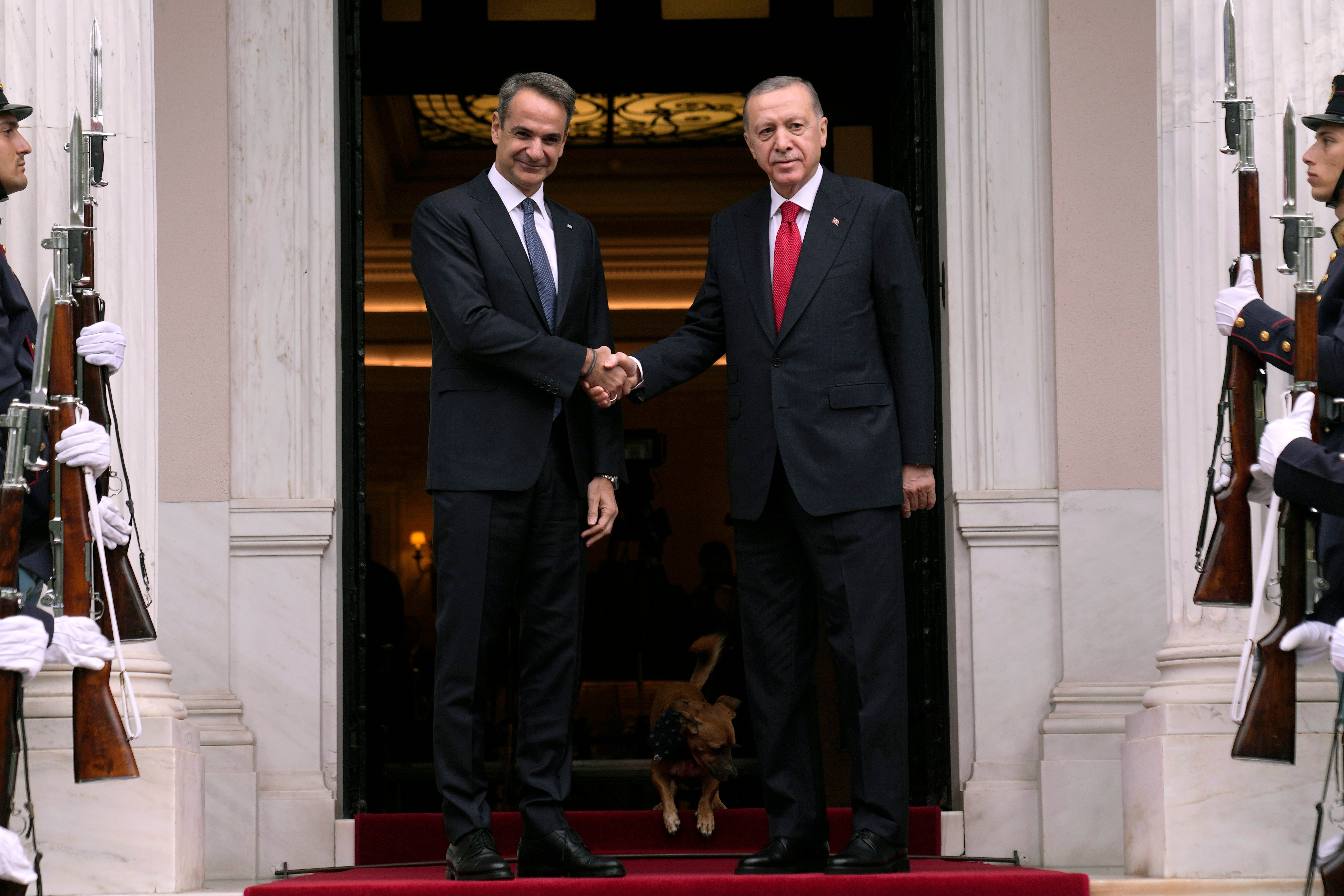 Greece’s Prime Minister Kyriakos Mitsotakis, left, welcomes the Turkey’s President Recep Tayyip Erdogan