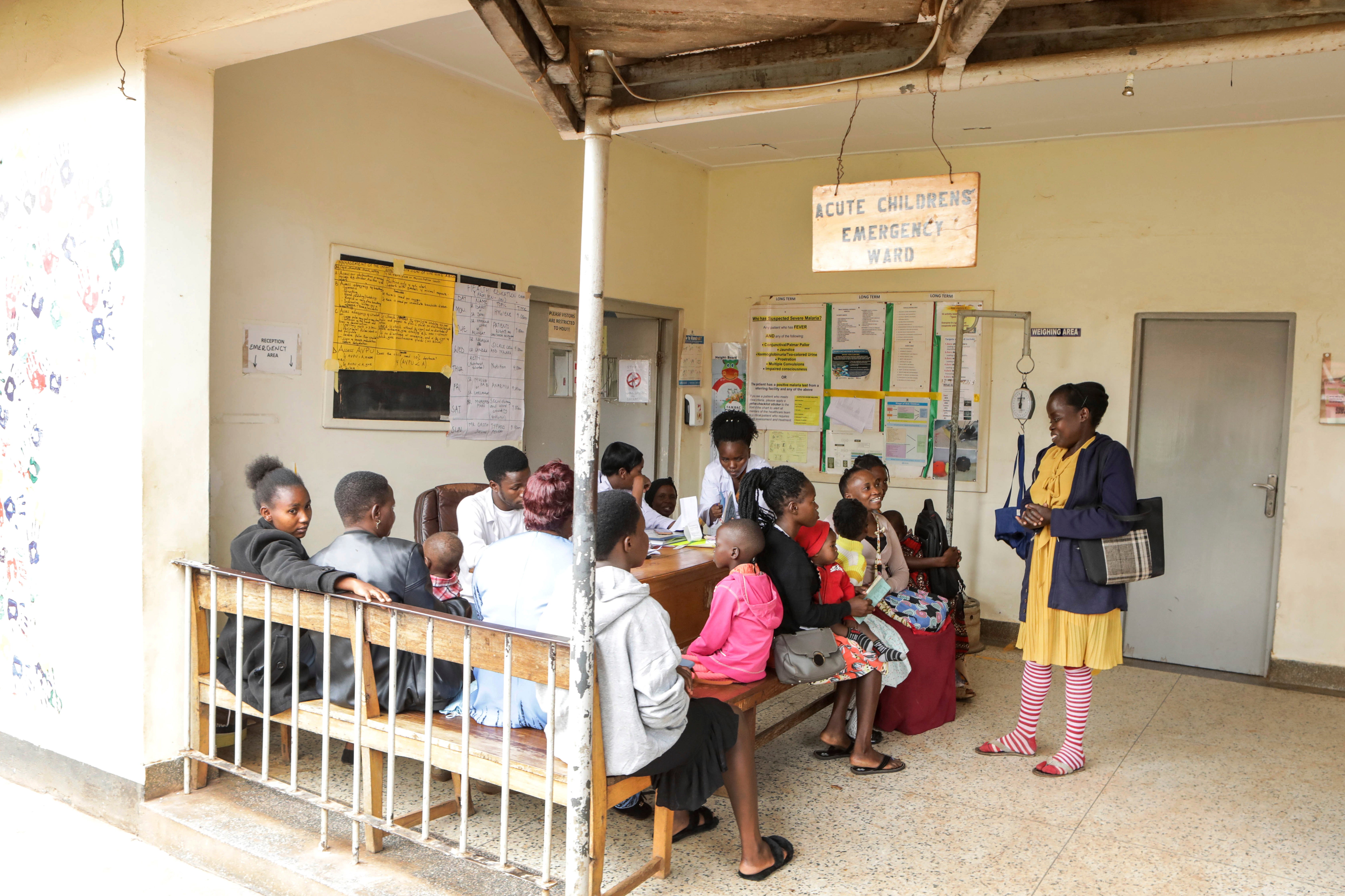 Barbara Nabulo talks to patients at the children’s emergency ward at Mbale Regional Referral Hospital, in Mbale, Uganda