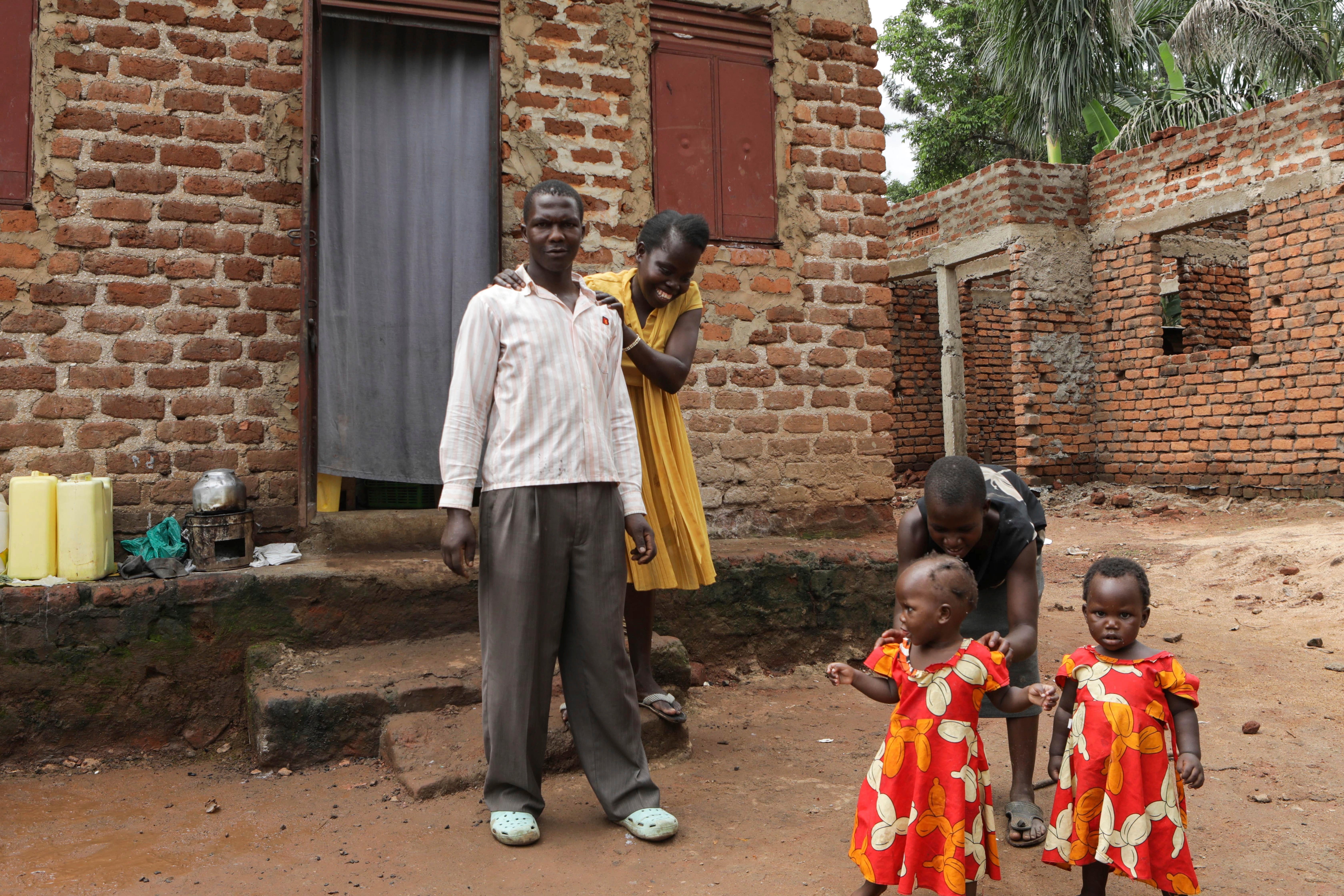 Barbara Nabulo who lives with sickle cell disease jokes with her husband at Busamaga-Mutukula village in Mbale, Uganda