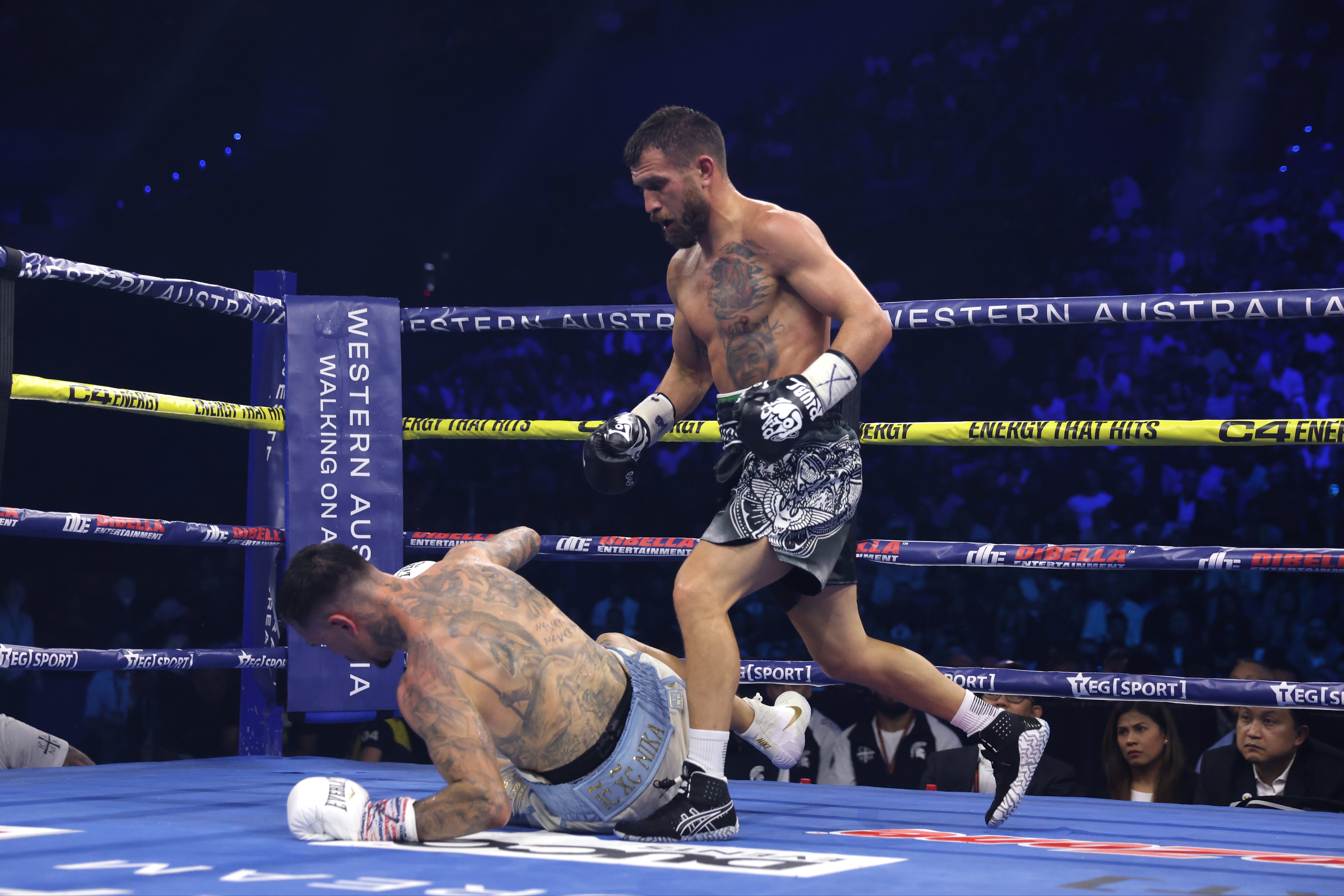 Vasyl Lomachenko (right) dropped George Kambosos Jr twice in the 11th round to earn a stoppage in his final fight
