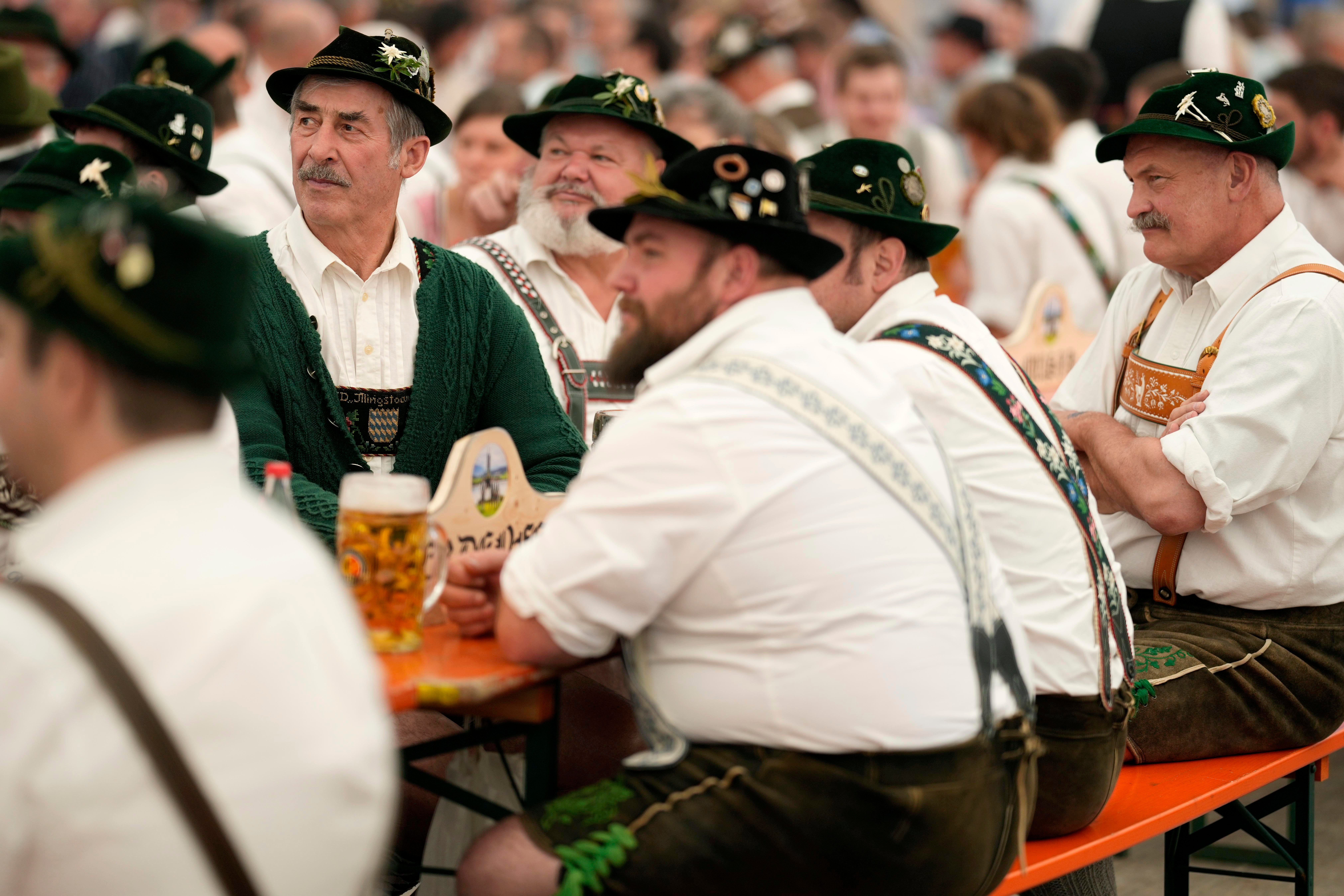 People dressed in traditional clothes attend the German Championships in Fingerhakeln or finger wrestling