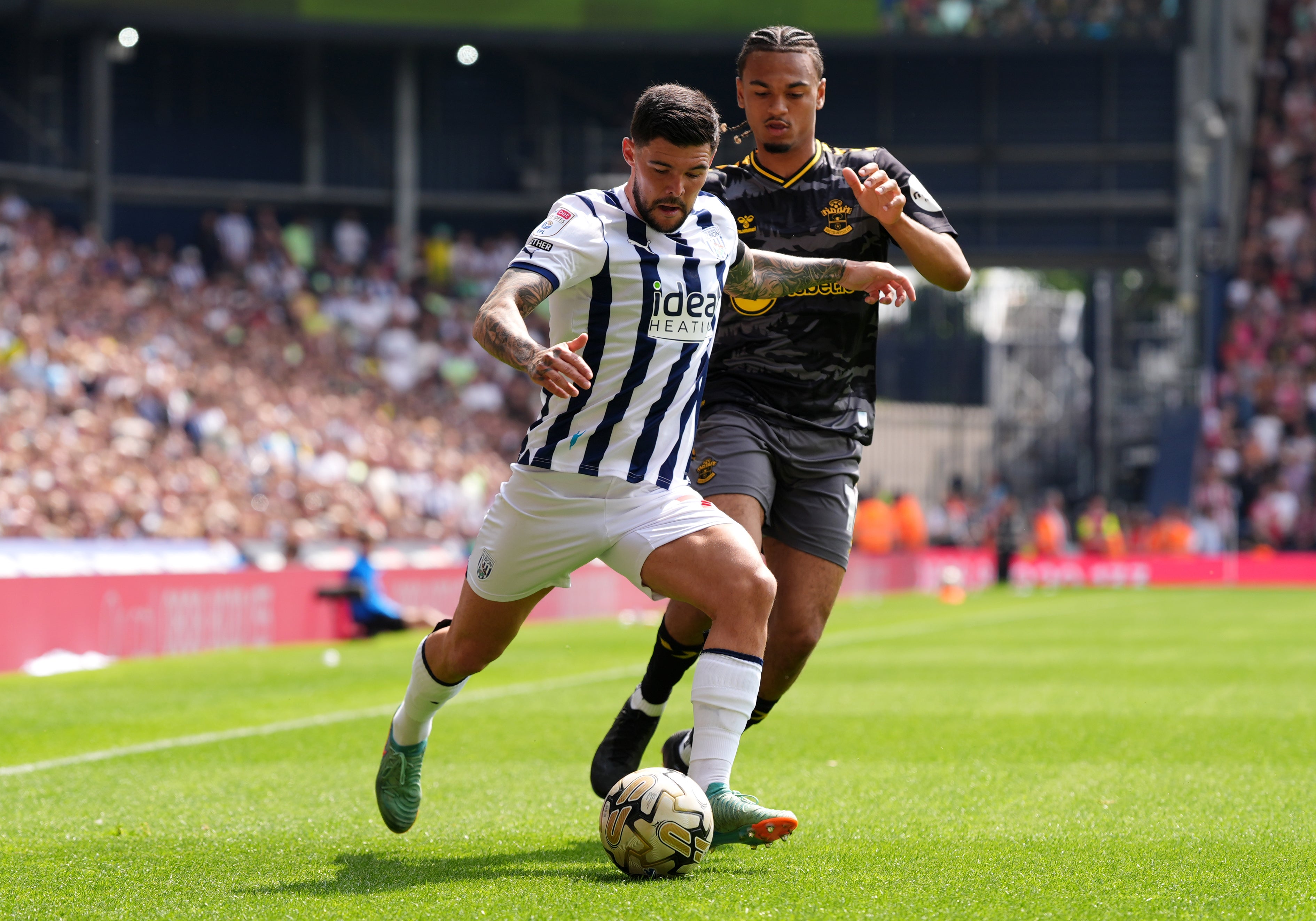 West Bromwich Albion's Alex Mowatt (left) and Southampton's Sekou Mara battle for the ball during the Championship play-off, semi-final, first-leg match at the Hawthorns