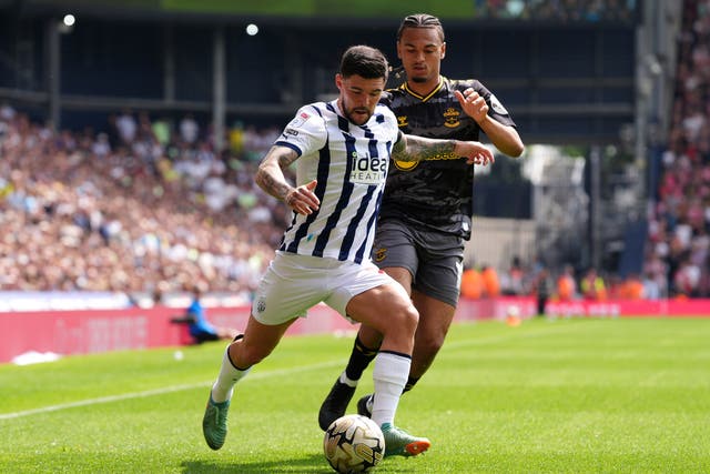 <p>West Bromwich Albion's Alex Mowatt (left) and Southampton's Sekou Mara battle for the ball during the Championship play-off, semi-final, first-leg match at the Hawthorns</p>