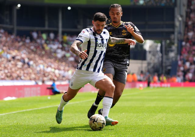 <p>West Bromwich Albion's Alex Mowatt (left) and Southampton's Sekou Mara battle for the ball during the Championship play-off, semi-final, first-leg match at the Hawthorns</p>