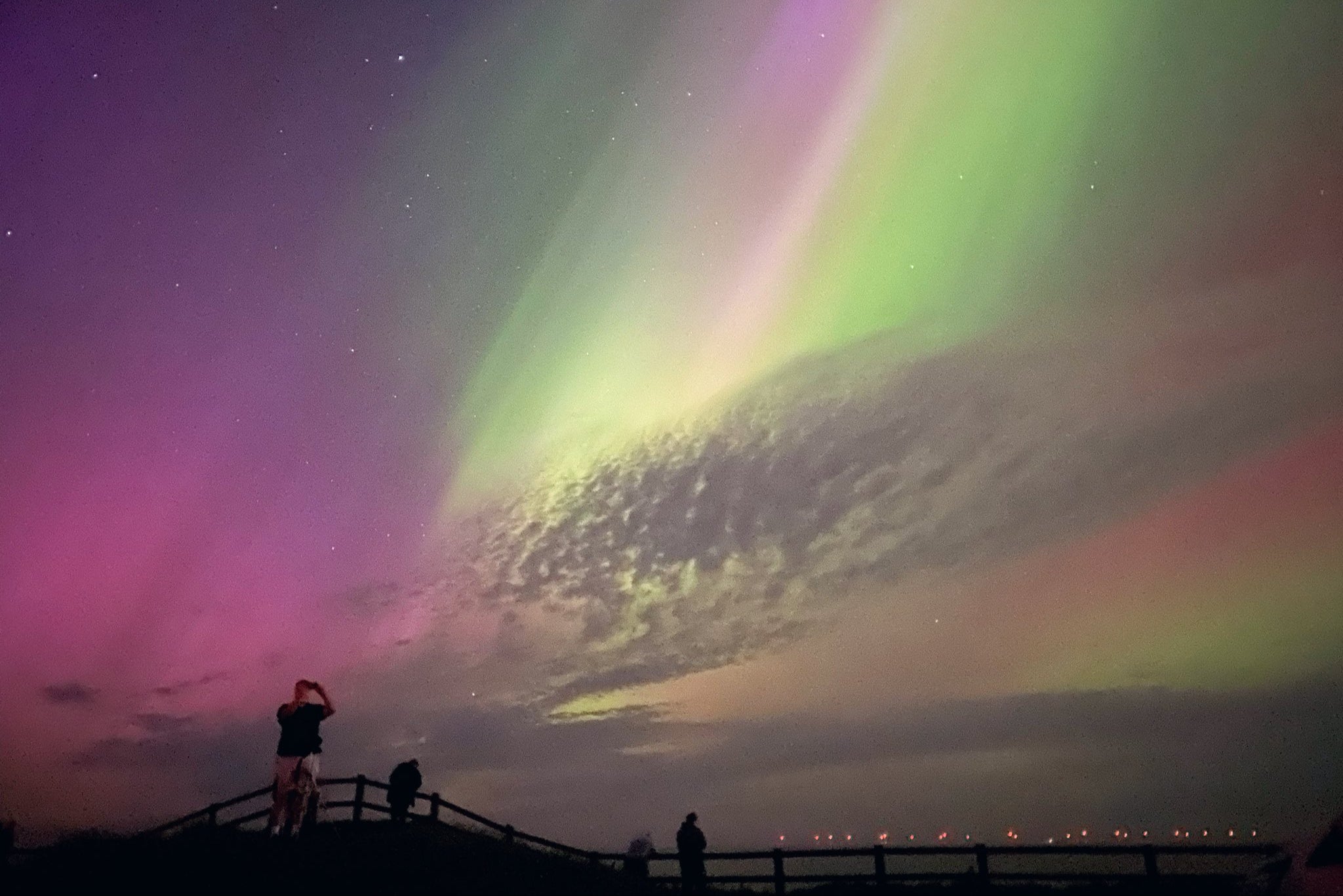 The Northern Lights glowing in the sky over Mappleton, East Yorkshire on Saturday 11 May as Britons get a rare glimpse of the stunning phenomenon
