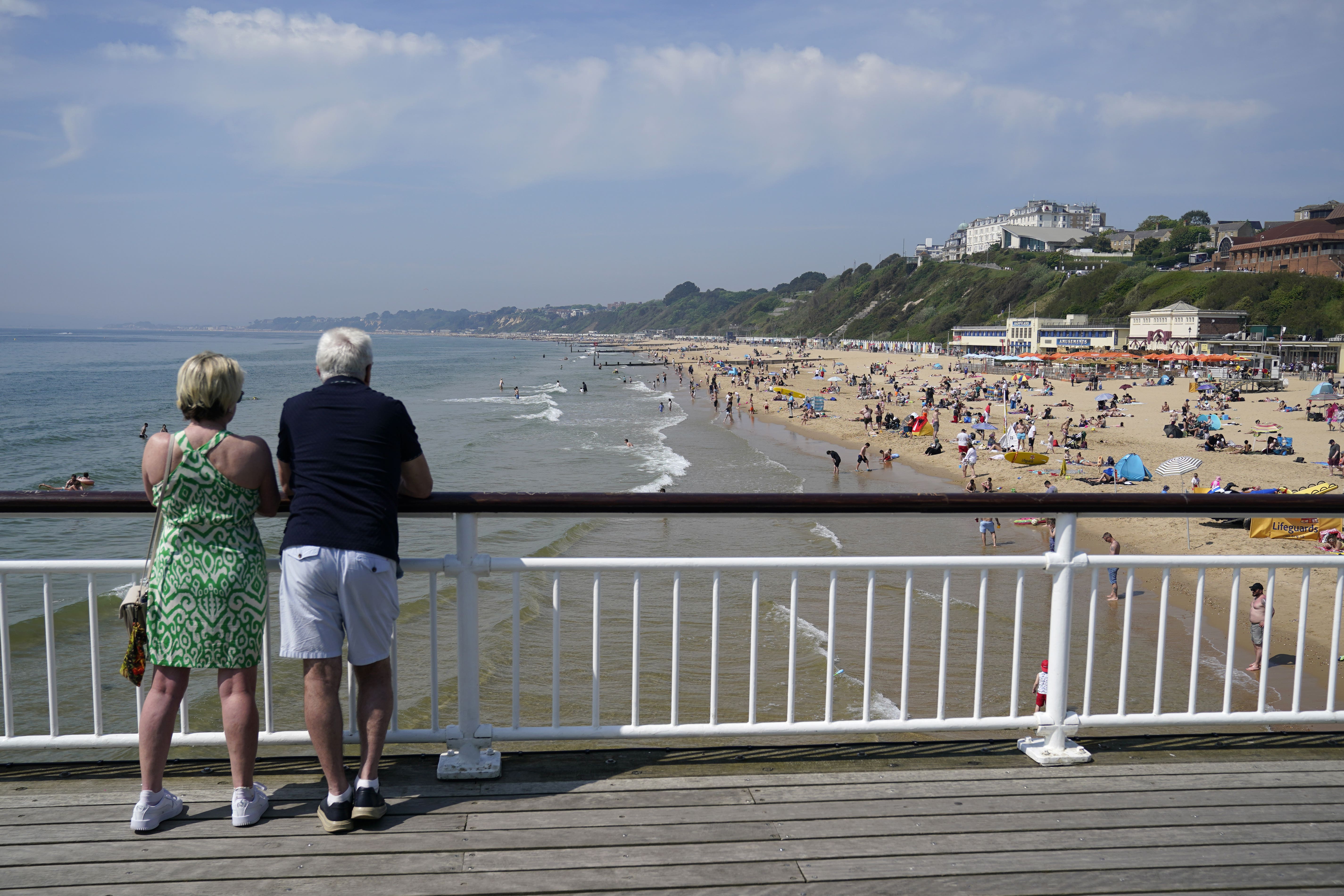 People enjoy the sun on Bournemouth Pier (Andrew Matthews/PA)