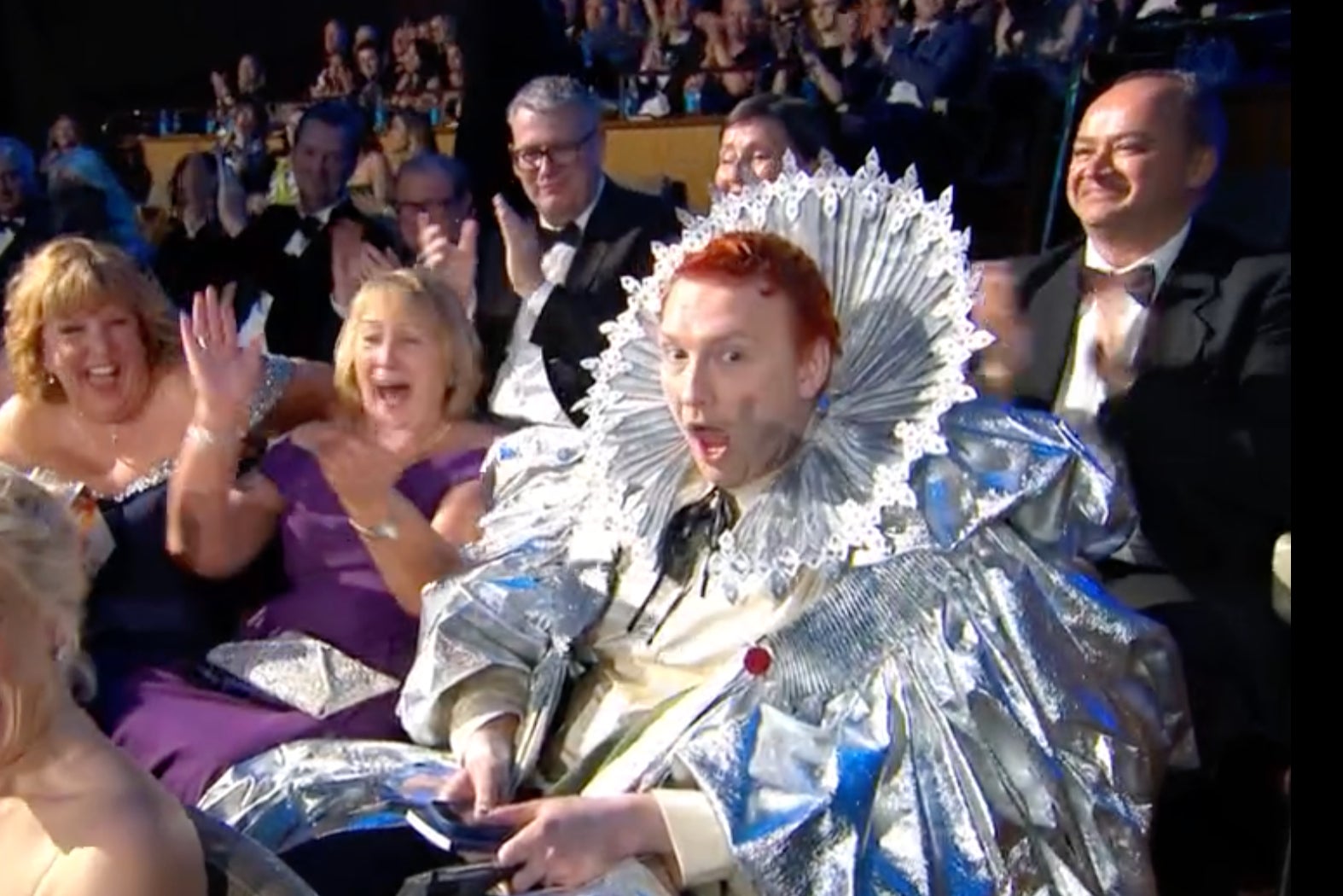 Joe Lycett, dressed as Queen Elizabeth, is surprised by his Bafta win for 'Late Night Lycett’