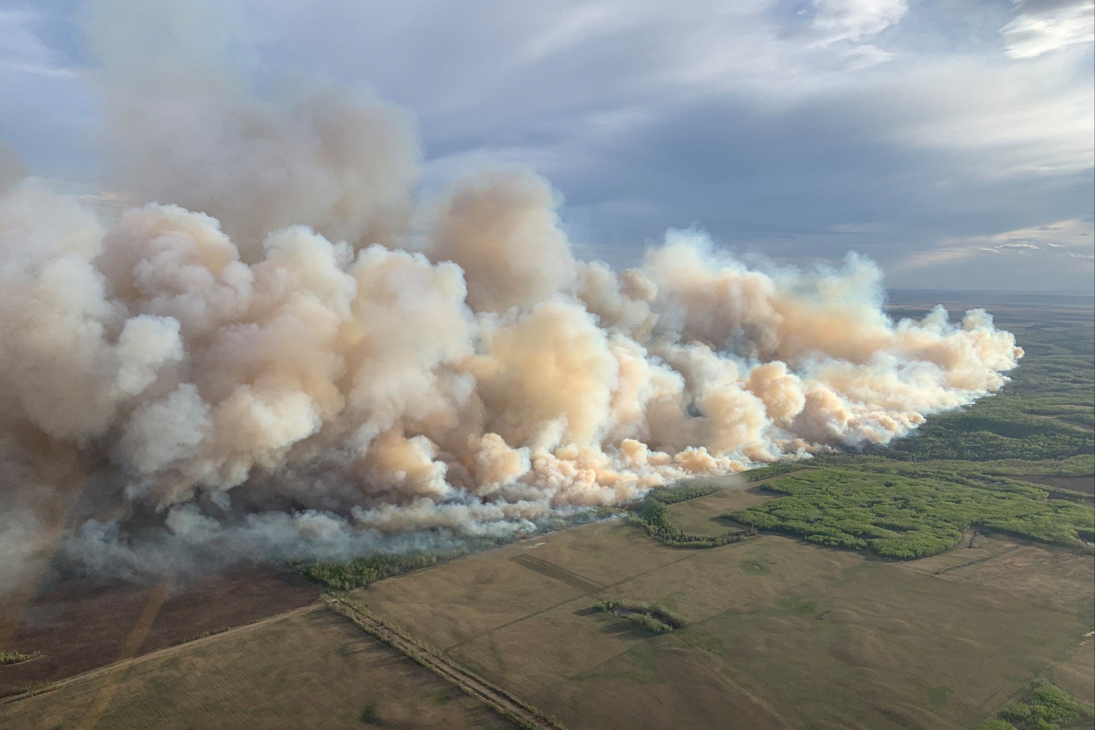 Canada’s first major wildfires of the year have spread to roughly 30 square miles