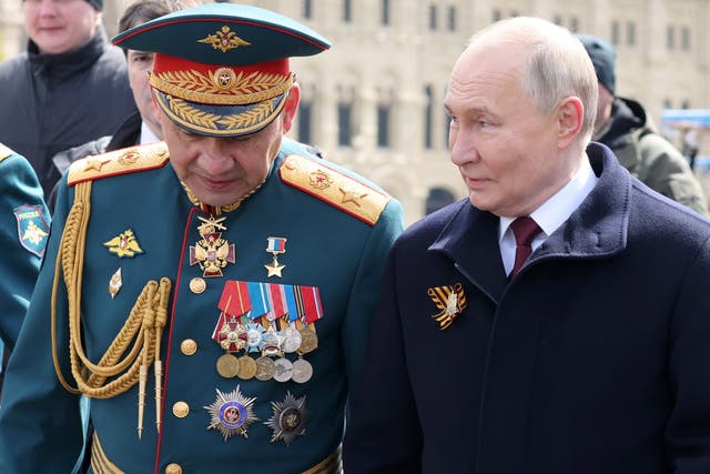 <p> Russian President Vladimir Putin (R) with Defence Minister Sergei Shoigu (L)</p>