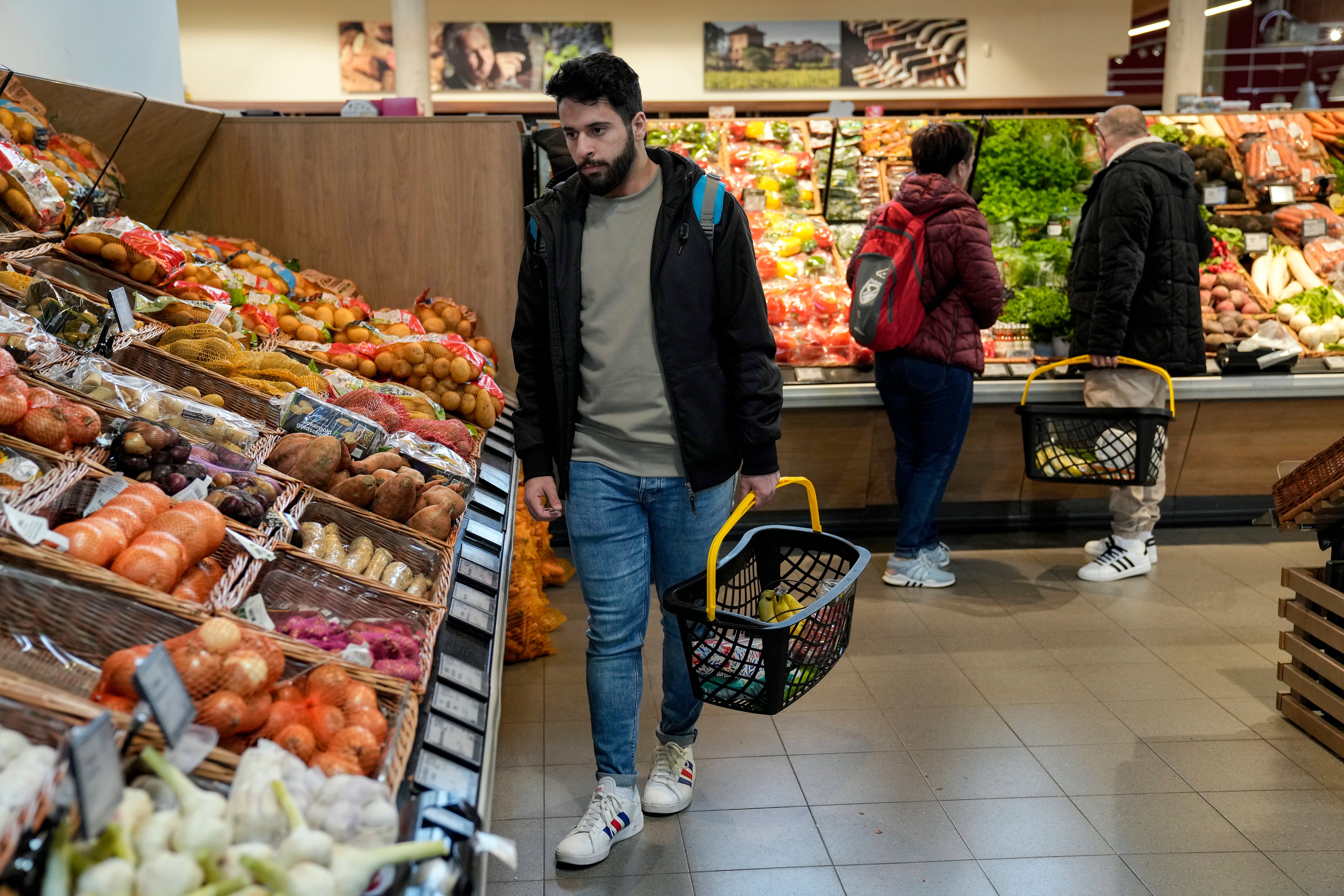Jihad Ammuri, a 20-year-old Palestinian asylum seeker, is shopping in a grocery store in Eichsfeld, Germany