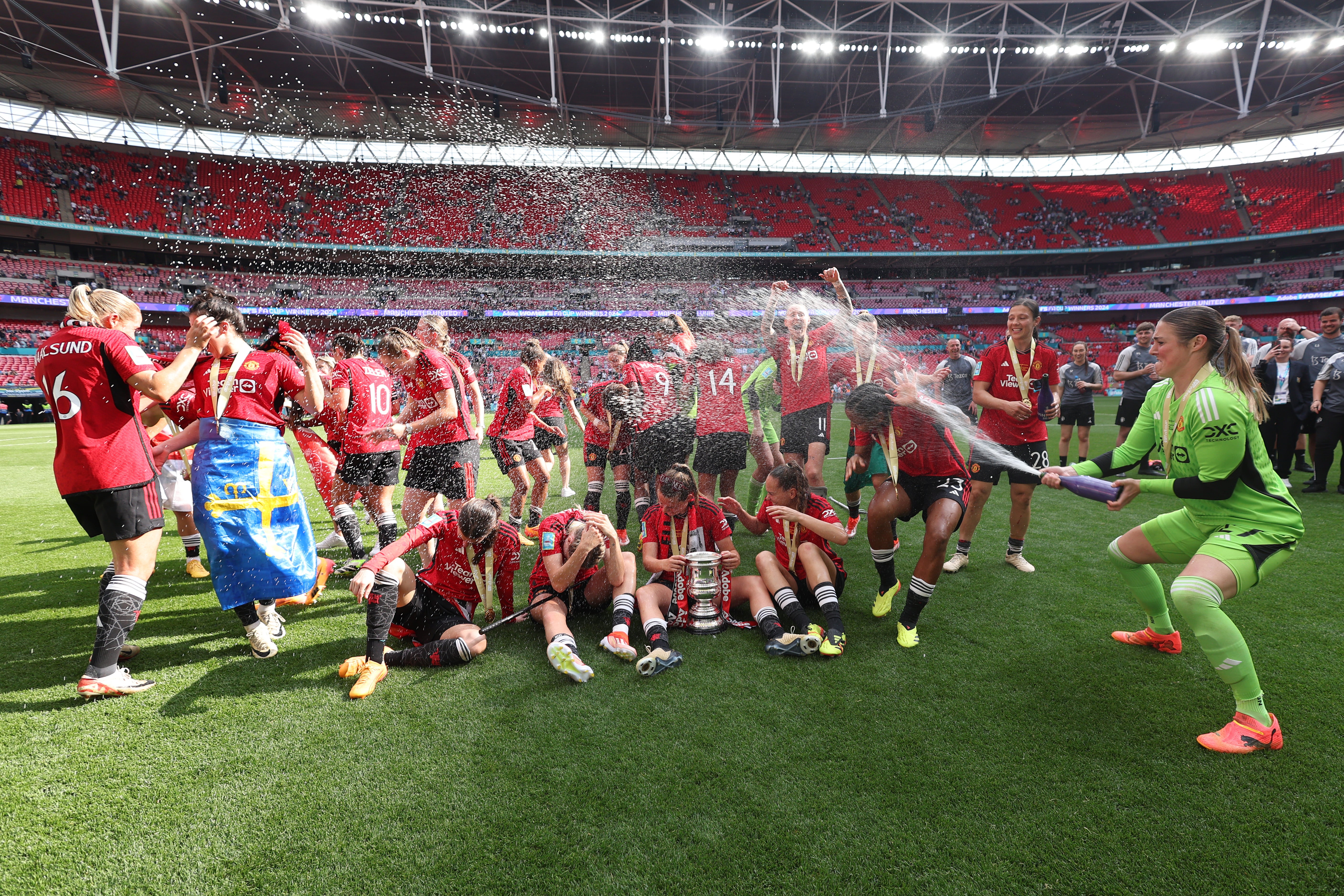 Mary Earps sprayed her teammates with champagne in celebration at their first FA Cup trophy