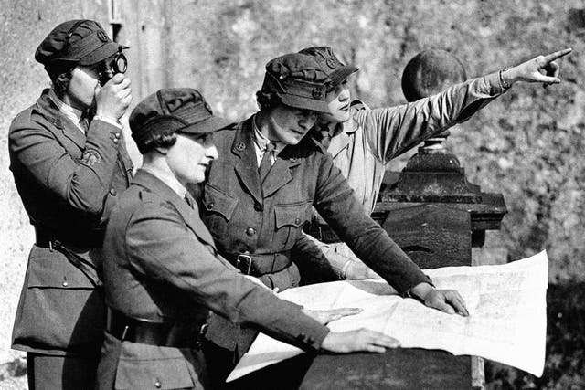 Members of the Women’s Transport Service (Northern Ireland Section) taking compass bearings from the terrace of Killyleagh Castle, County Down, Northern Ireland (PA Archive)