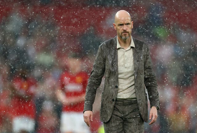 <p>A sodden Erik ten Hag leaves the pitch after Manchester United’s defeat by Arsenal</p>