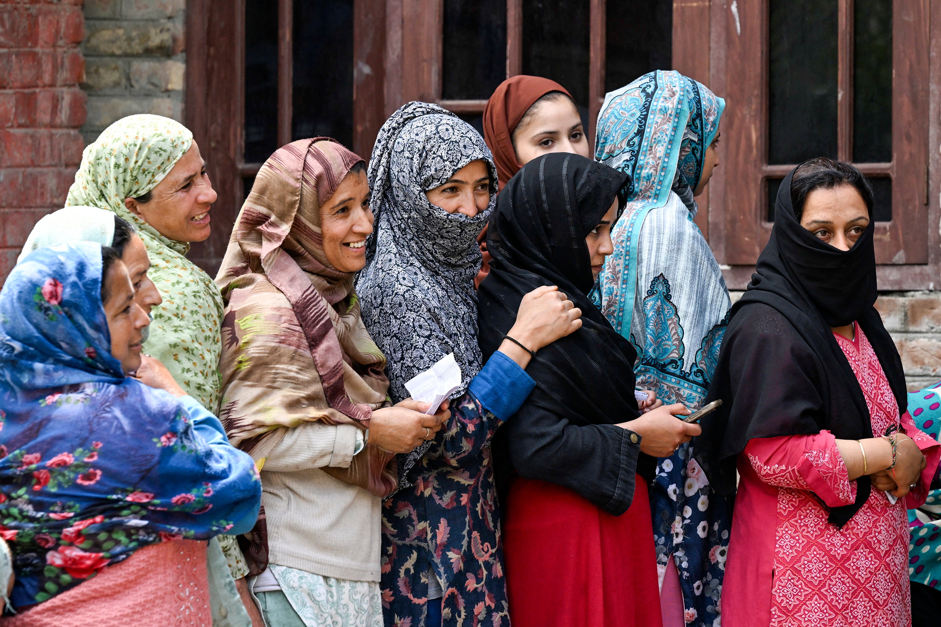 Voters queue up to cast their ballots at a polling station during the fourth phase of voting in India’s general election, in Srinagar