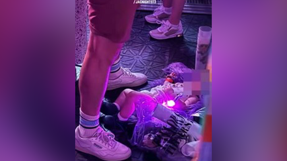 Baby seen sleeping on the floor of the standing section at Swift’s Paris concert