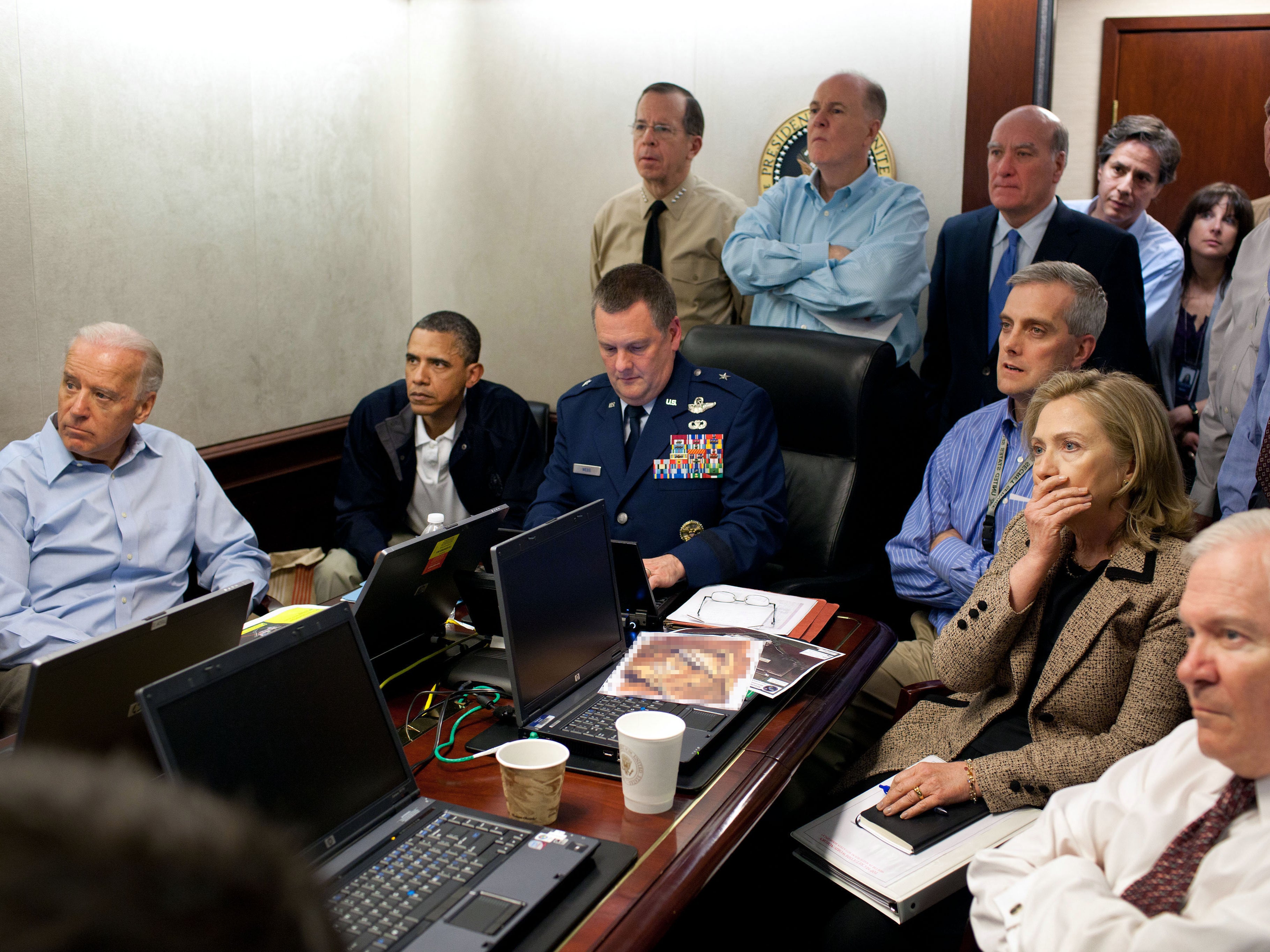President Barack Obama, vice president Joe Biden, secretary of state Hillary Clinton and members of the national security team receive an update on the mission against Osama bin Laden in the Situation Room of the White House on 1 May 2011 in Washington, DC
