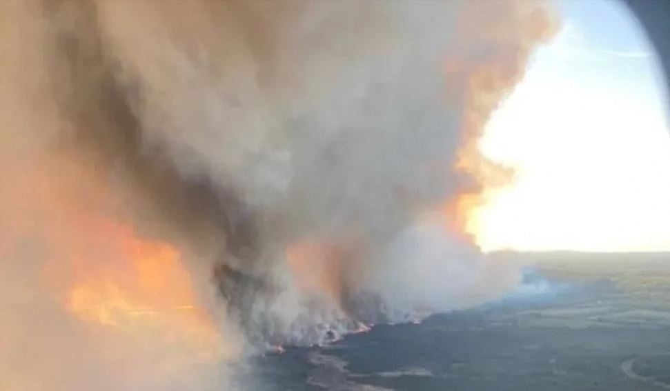 An arial image of the Parker Lake wildfire burning near Fort Nelson in British Columbia. Strong winds fueled the fire over the weekend, officials said