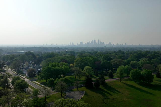 <p>Wildfire smoke hangs over the Minneapolis skyline on May 13, 2024</p>