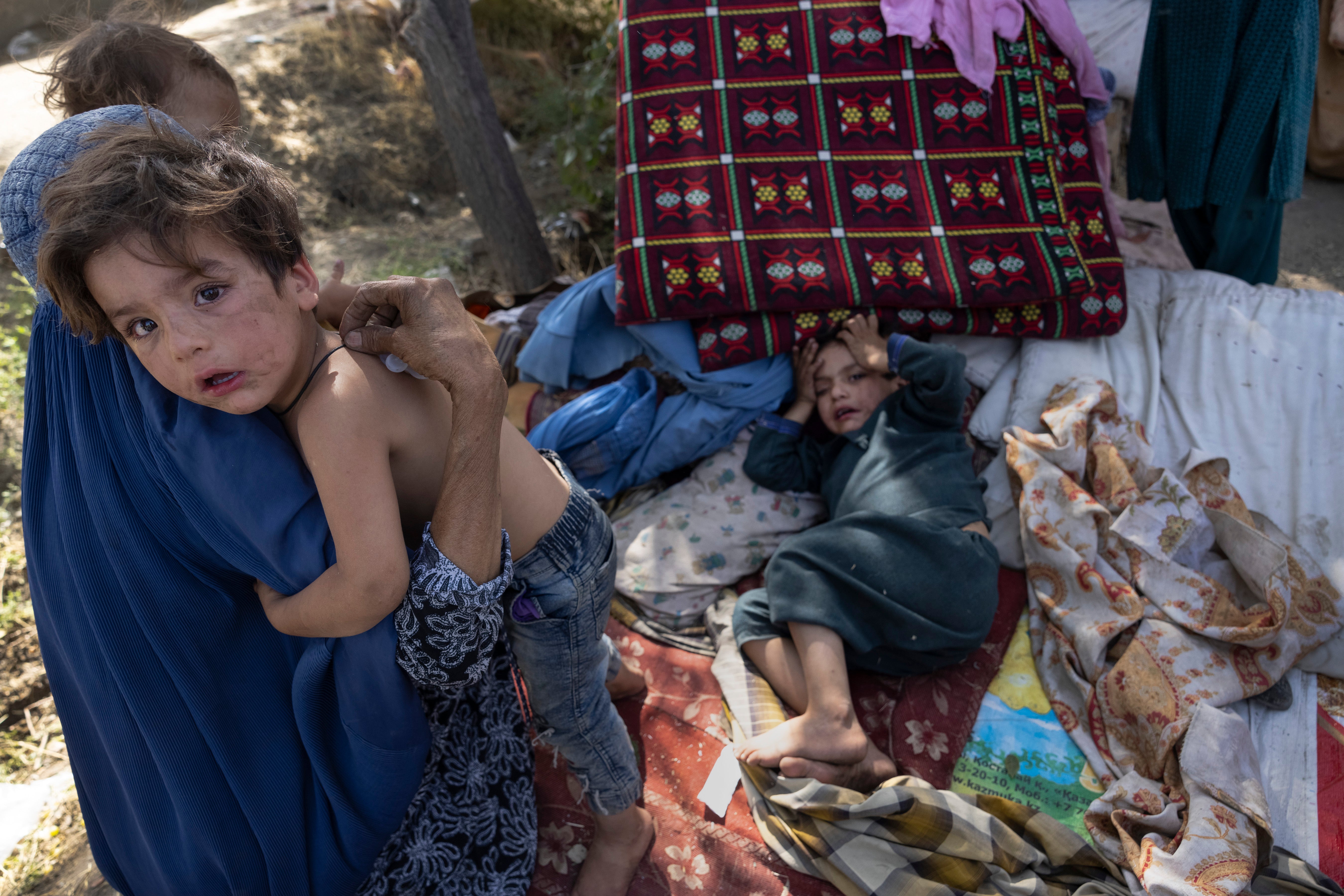 Displaced Afghans arrive at a makeshift camp in Kabul from the northern provinces, leaving their homes behind