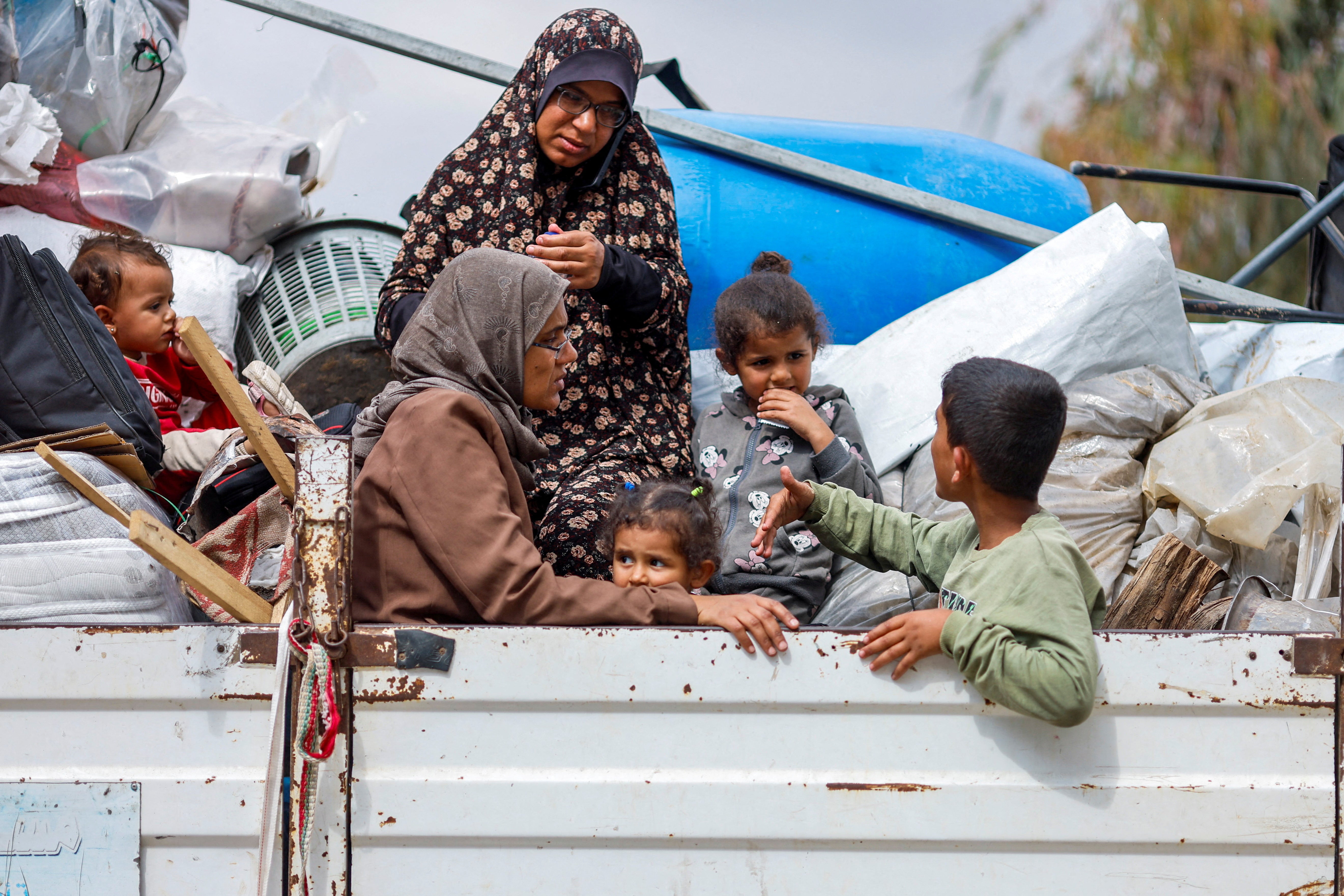 Palestinians ride on a vehicle as they flee Rafah – the UN estimates some 360,000 have left the city in the past week