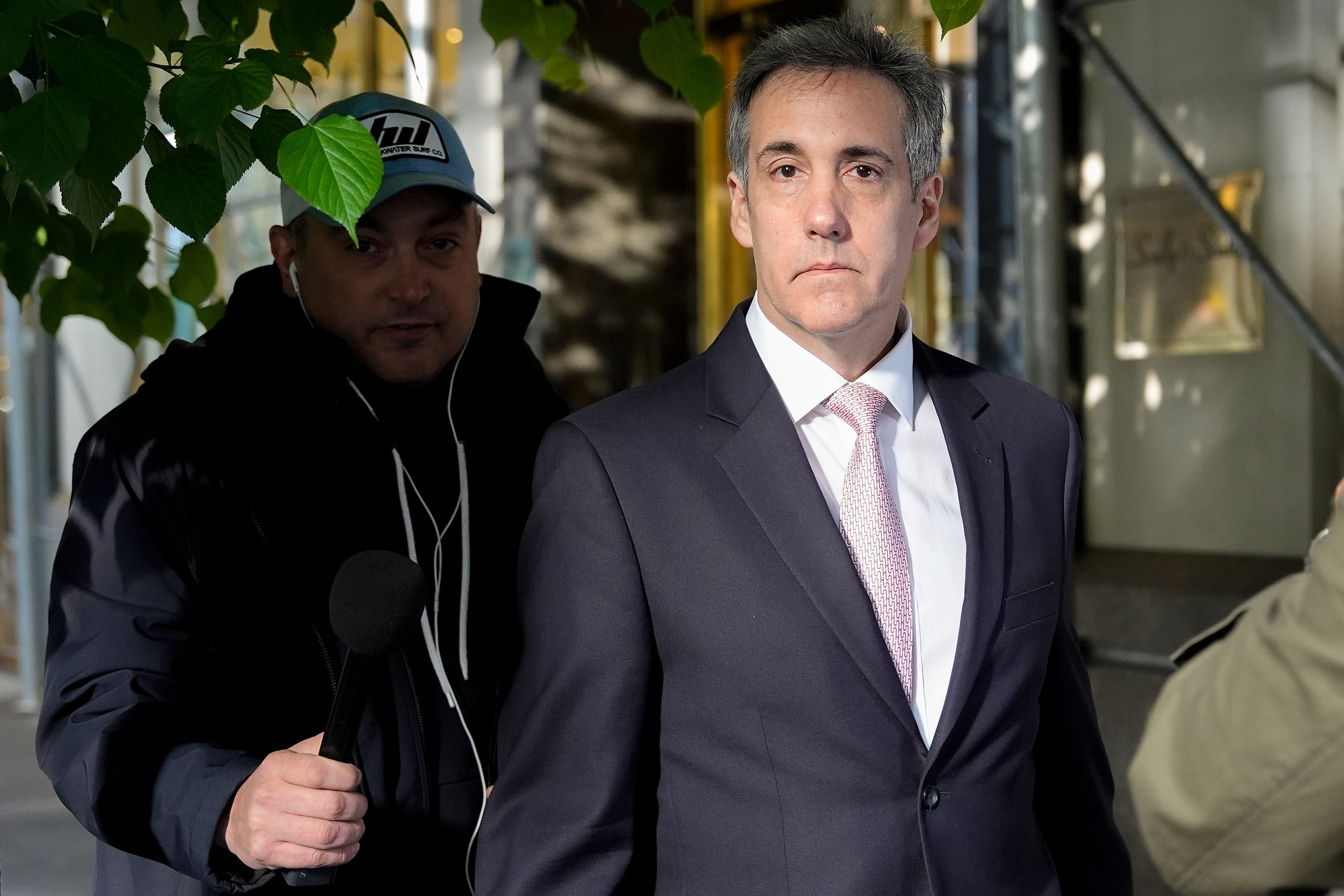 Cohen leaves his apartment building on his way to Manhattan criminal court on Monday