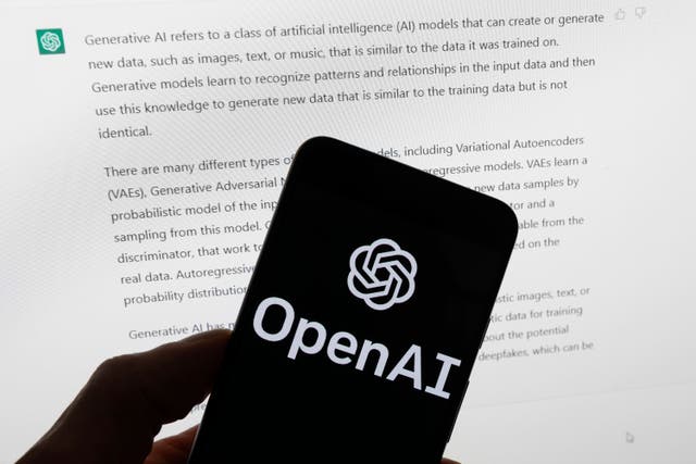 FILE – The OpenAI logo is seen on a mobile phone in front of a computer screen displaying output from ChatGPT, March 21, 2023, in Boston. OpenAI has introduced a new artificial intelligence model. It says it works faster than previous versions and can reason across text, audio and video in real time. (AP Photo/Michael Dwyer, File)