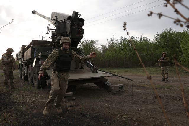 <p>Ukrainian forces use a howitzer to hit Russian targets near Kharkiv</p>