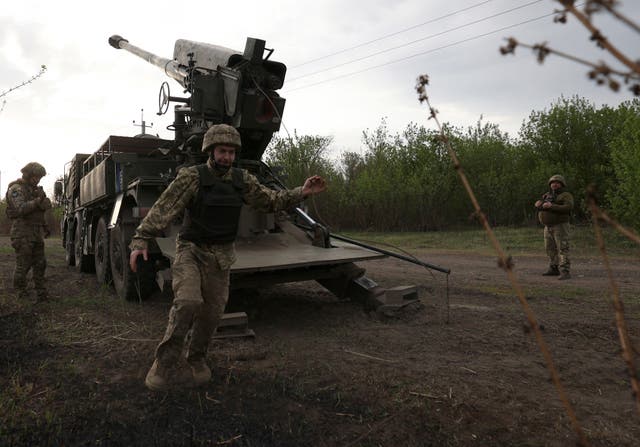 <p>Ukrainian forces use a howitzer to hit Russian targets near Kharkiv</p>