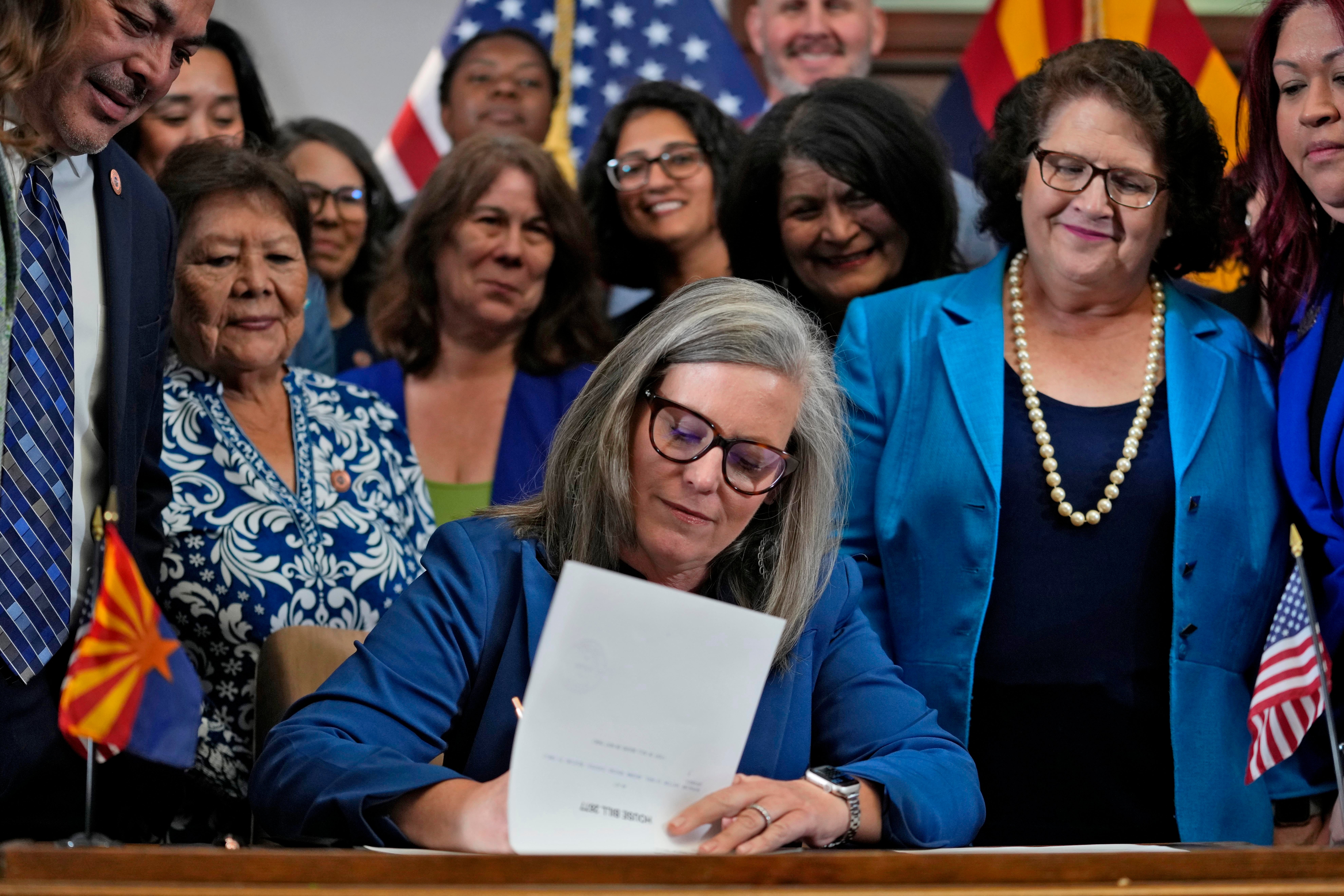 Arizona Gov Katie Hobbs signs the repeal of the Civil War-era near-total abortion ban on 2 May 2024