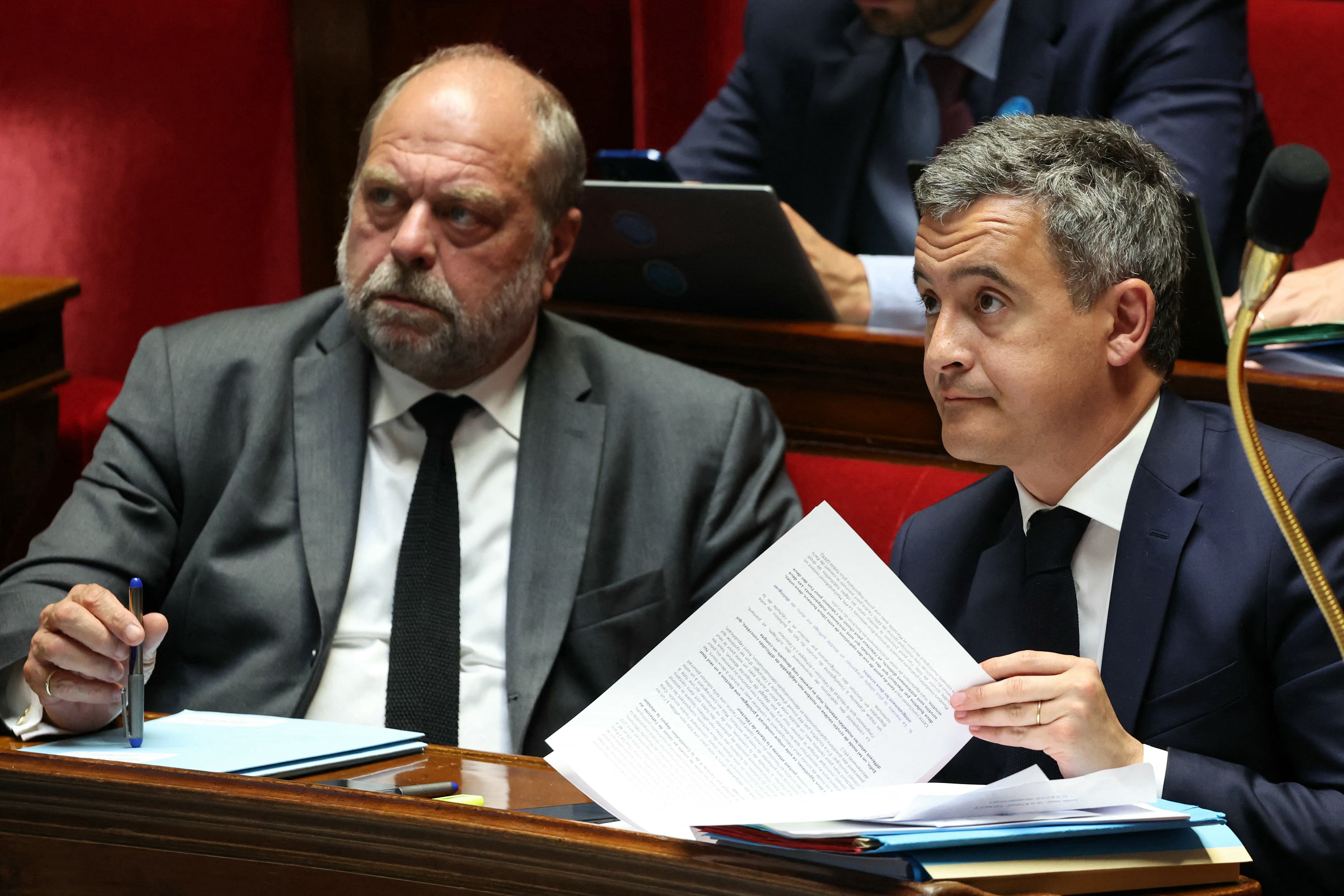 France's Minister for Interior and Overseas Gerald Darmanin (R) and France's Justice Minister Eric Dupond-Moretti attend a debate on the constitutional bill aimed at enlarging the electorate of the overseas French territory of New Caledonia