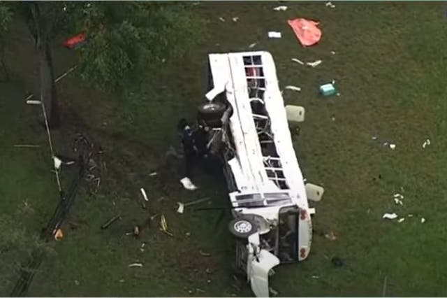 <p>A bus was seen on its side in a field off State Road 40 in Marion County, Florida on Tuesday 14 May 2024</p>