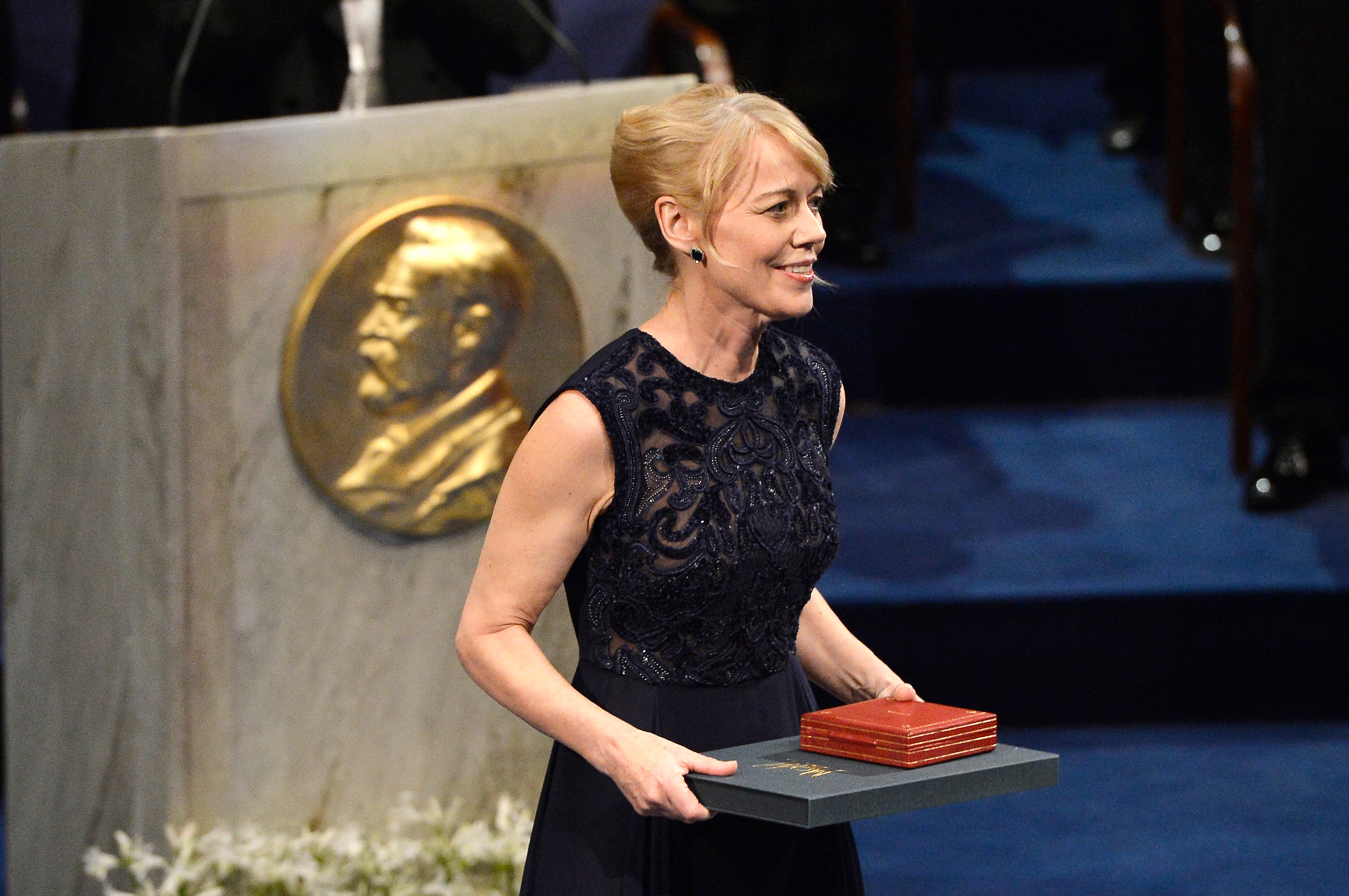 Alice Munro’s daughter, Jenny, accepts the Nobel Prize in Literature on her mother’s behalf in 2013