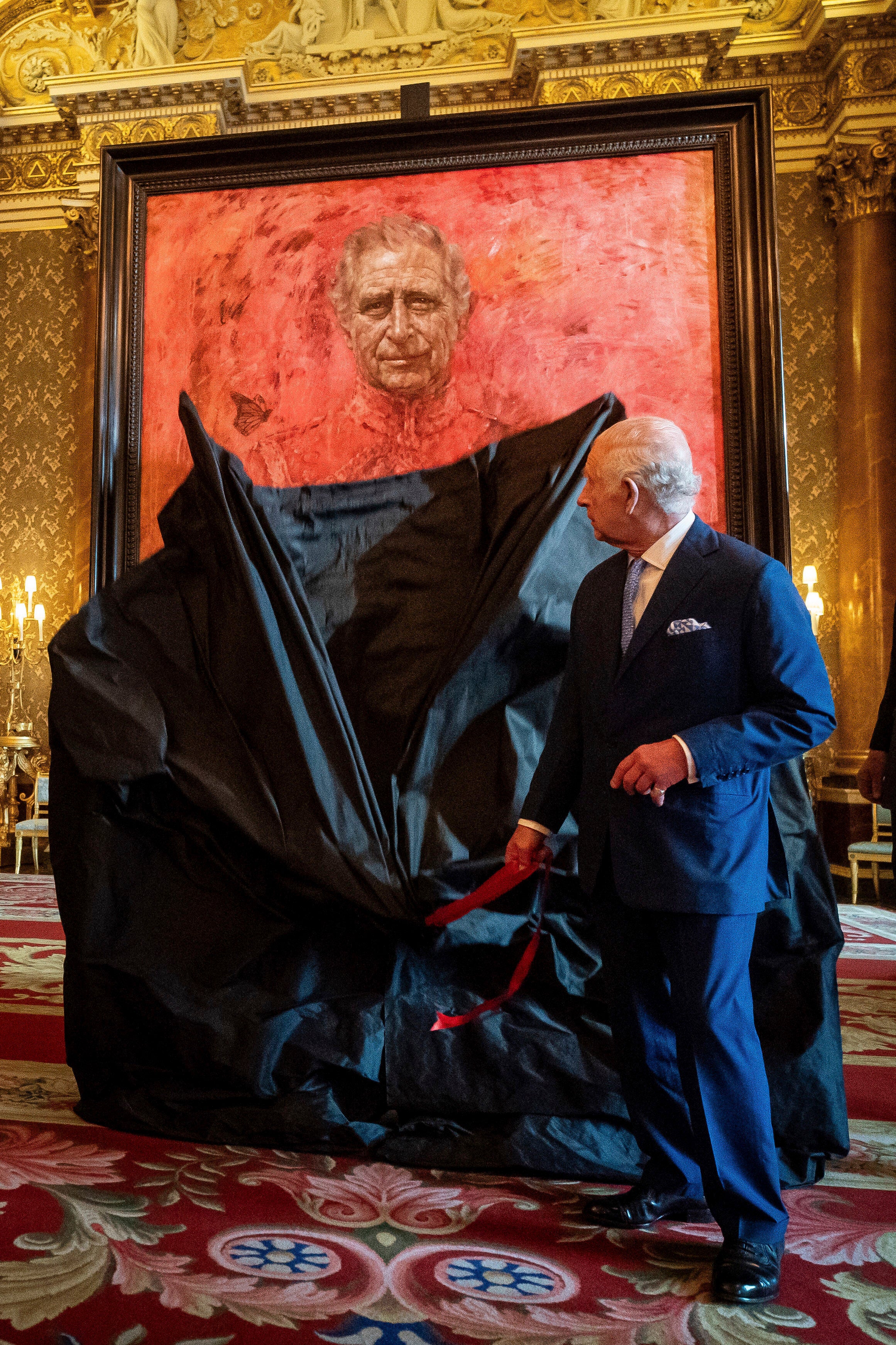 King Charles III unveils artist Jonathan Yeo's portrait of the monarch in the blue drawing room at Buckingham Palace