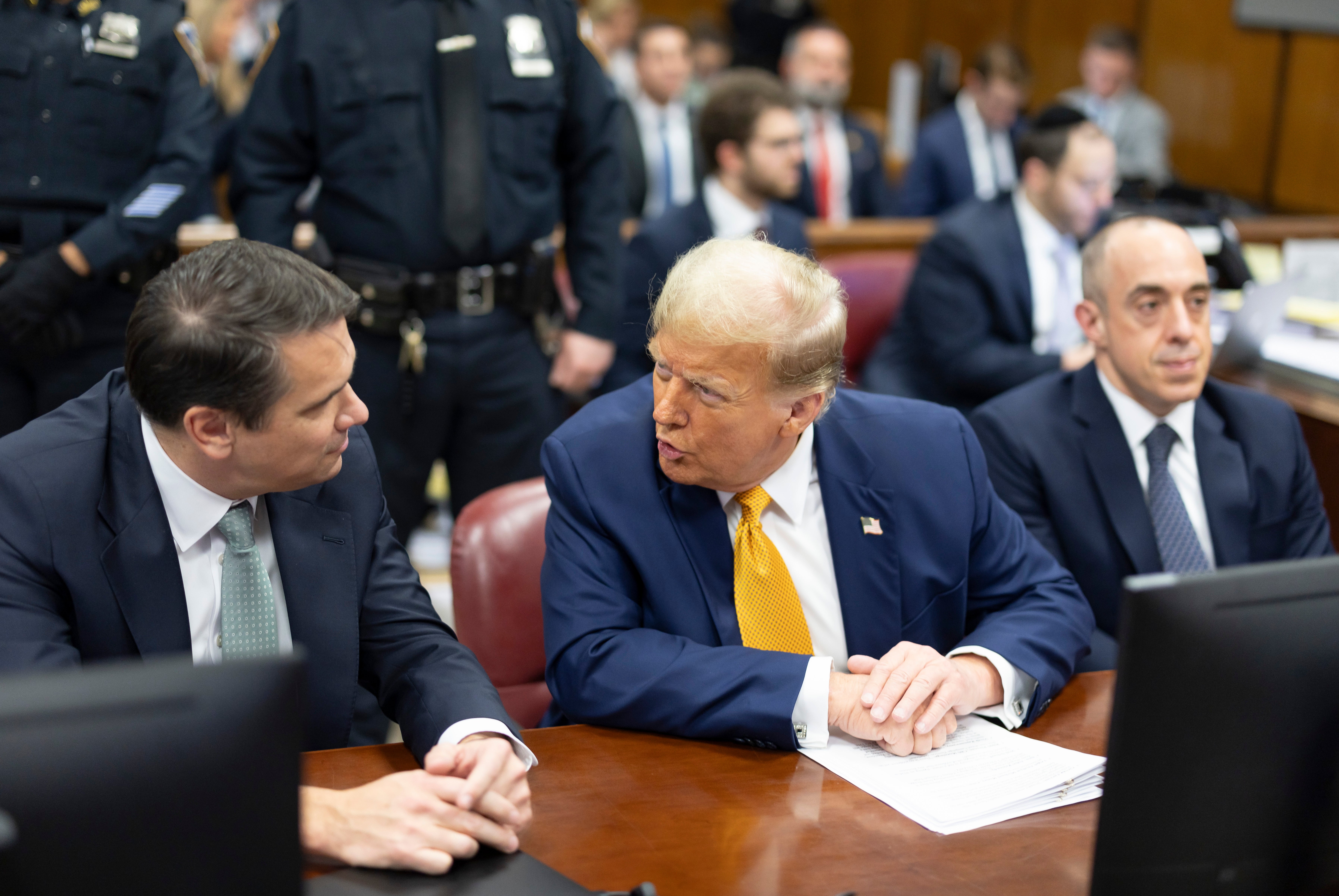 Donald Trump speaks with his attorneys during his hush money trial in Manhattan on 14 May