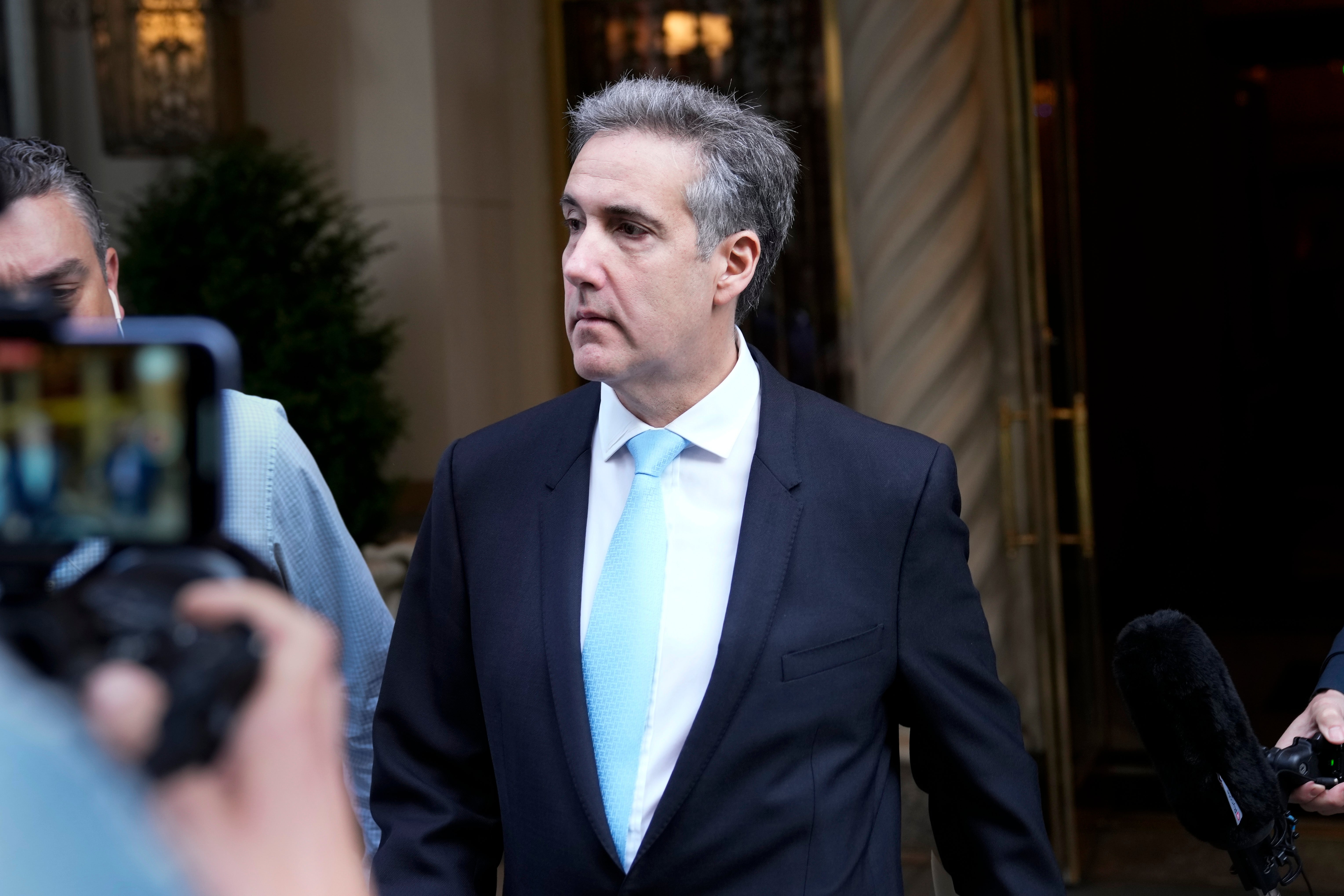 Cohen leaves his apartment building as he heads for Manhattan criminal court