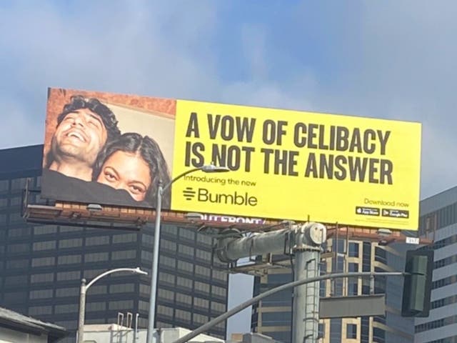<p>A photo of a Bumble billboard saying, ‘A vow of celibacy is not the answer'</p>