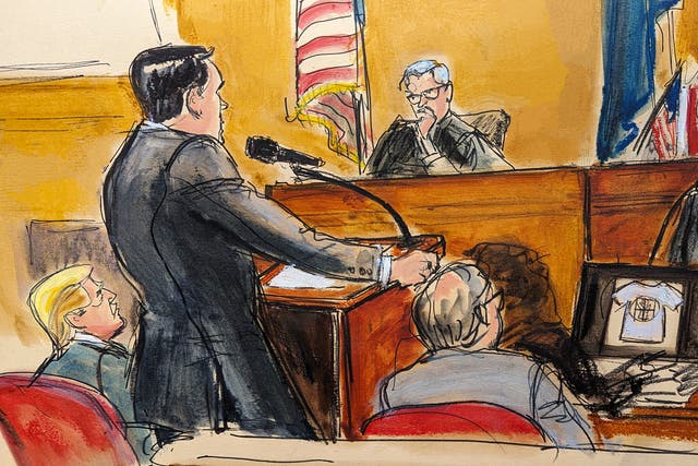 <p>Michael Cohen is questioned by prosecutor Susan Hoffinger before Justice Juan Merchan while a reimbursement check is shown on screen, as former president Donald Trump and his lawyer Emil Bove watch</p>