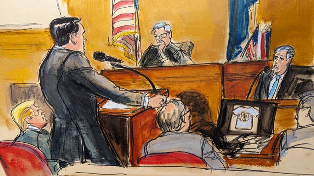 <p>Michael Cohen is questioned by prosecutor Susan Hoffinger before Justice Juan Merchan while a reimbursement check is shown on screen, as former president Donald Trump and his lawyer Emil Bove watch</p>